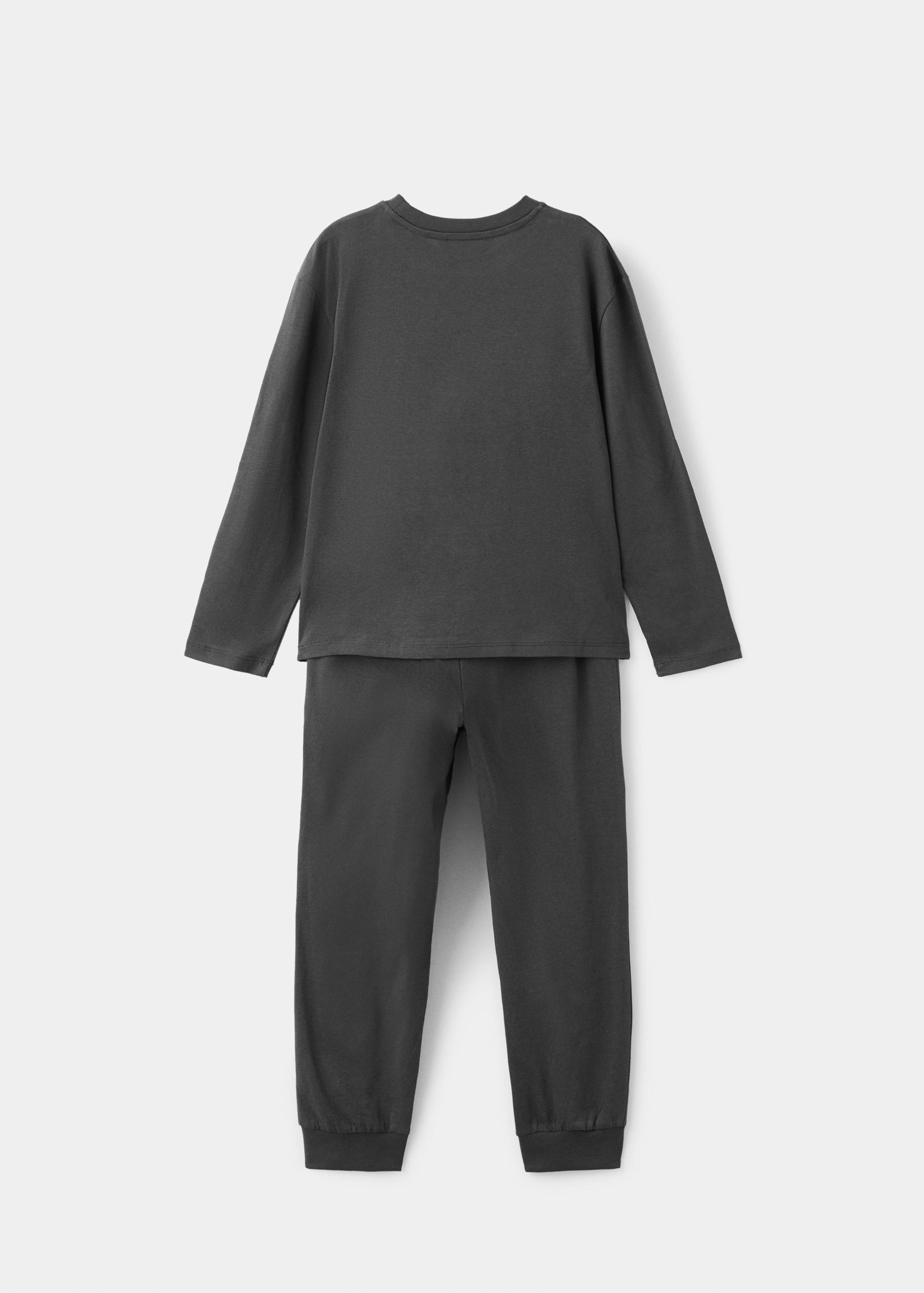 Pijama esqueleto brilla en la ocuridad - Reverso del artículo