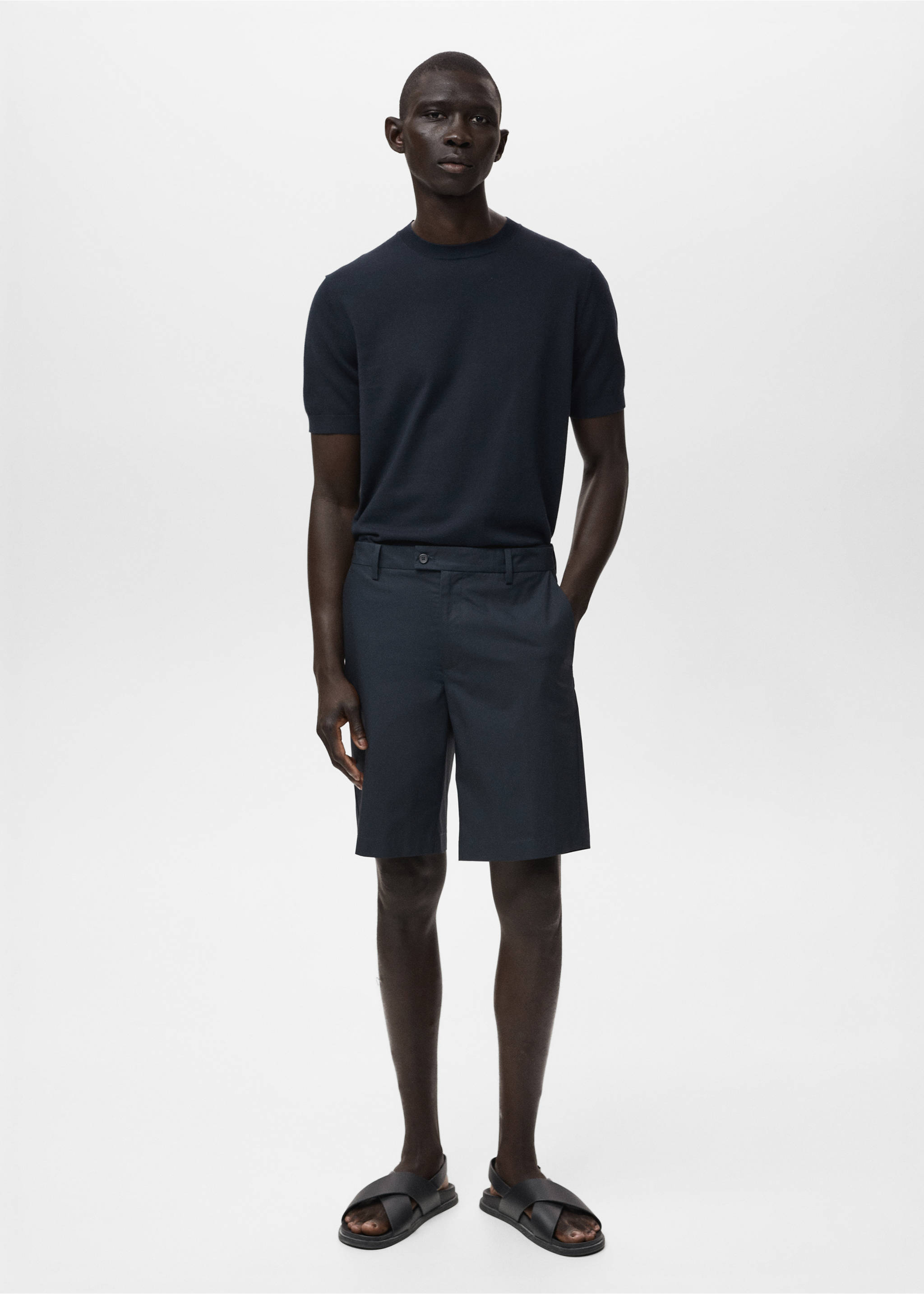 Navy blue bermuda shorts worn with a matching knit t-shirt and black sandals., Navy. Ref: 17081161-00.