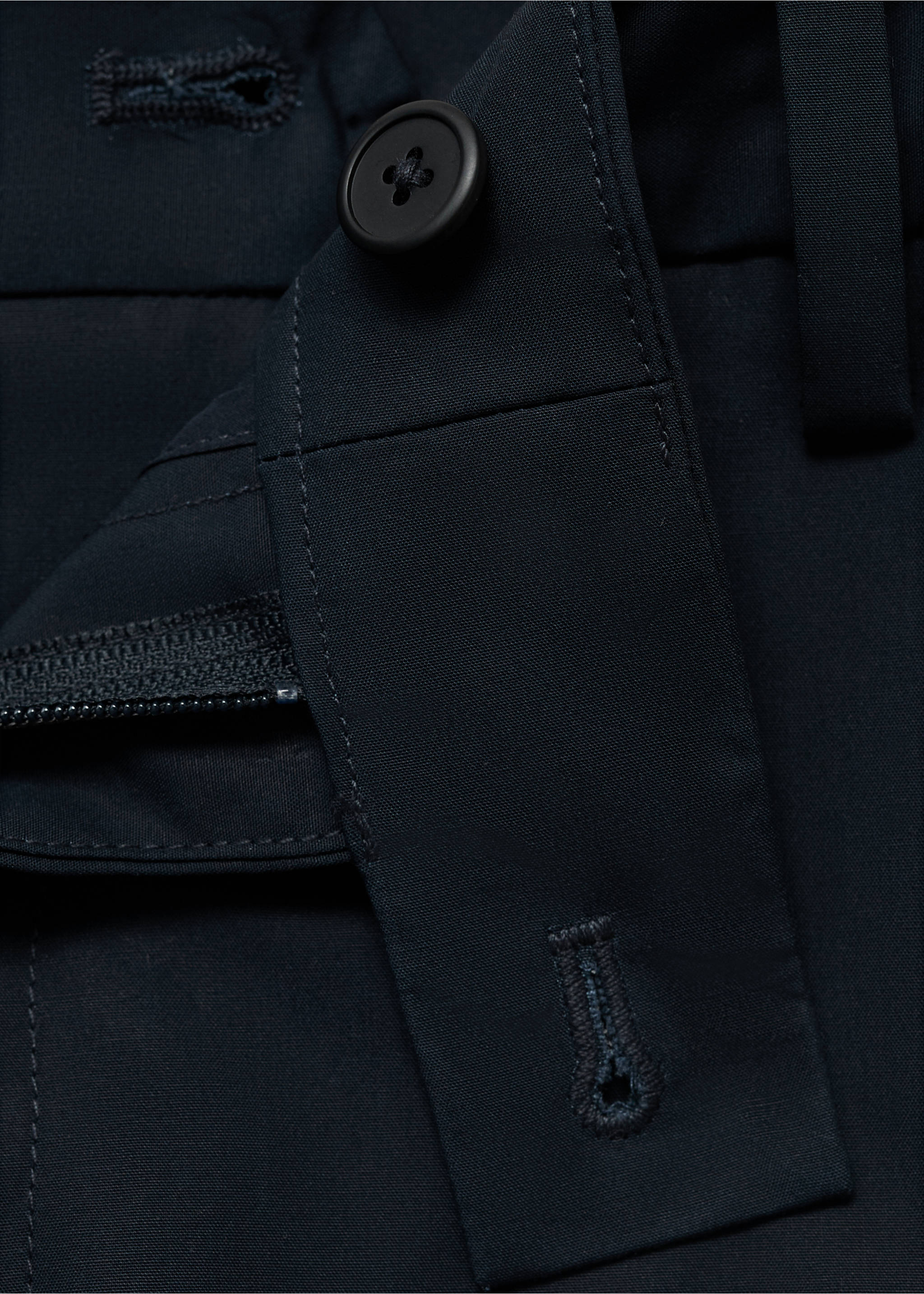 Close-up of dark navy blue bermuda shorts waistband with a button closure., Navy. Ref: 17081161-00.