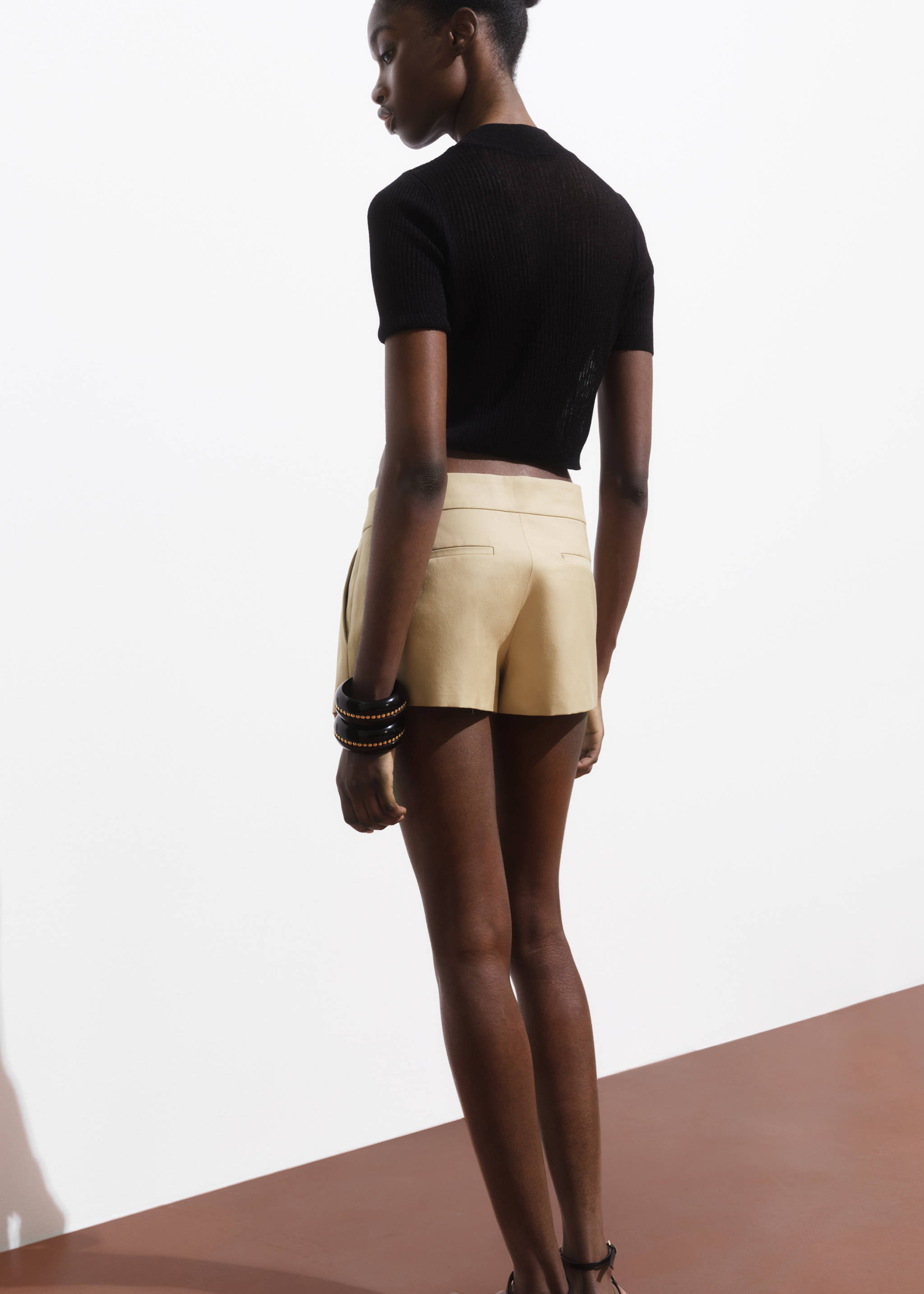 Mini-skirt with pleats - Reverse of the article