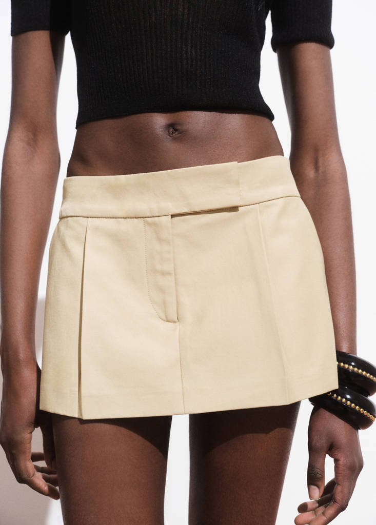 Mini-skirt with pleats — Beige