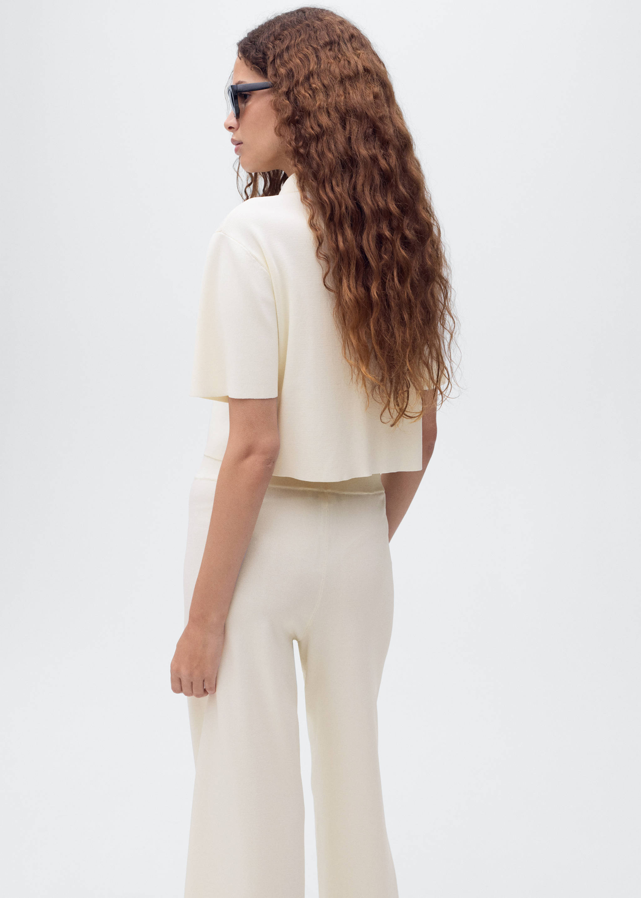 Short-sleeved knitted jacket - Reverse of the article