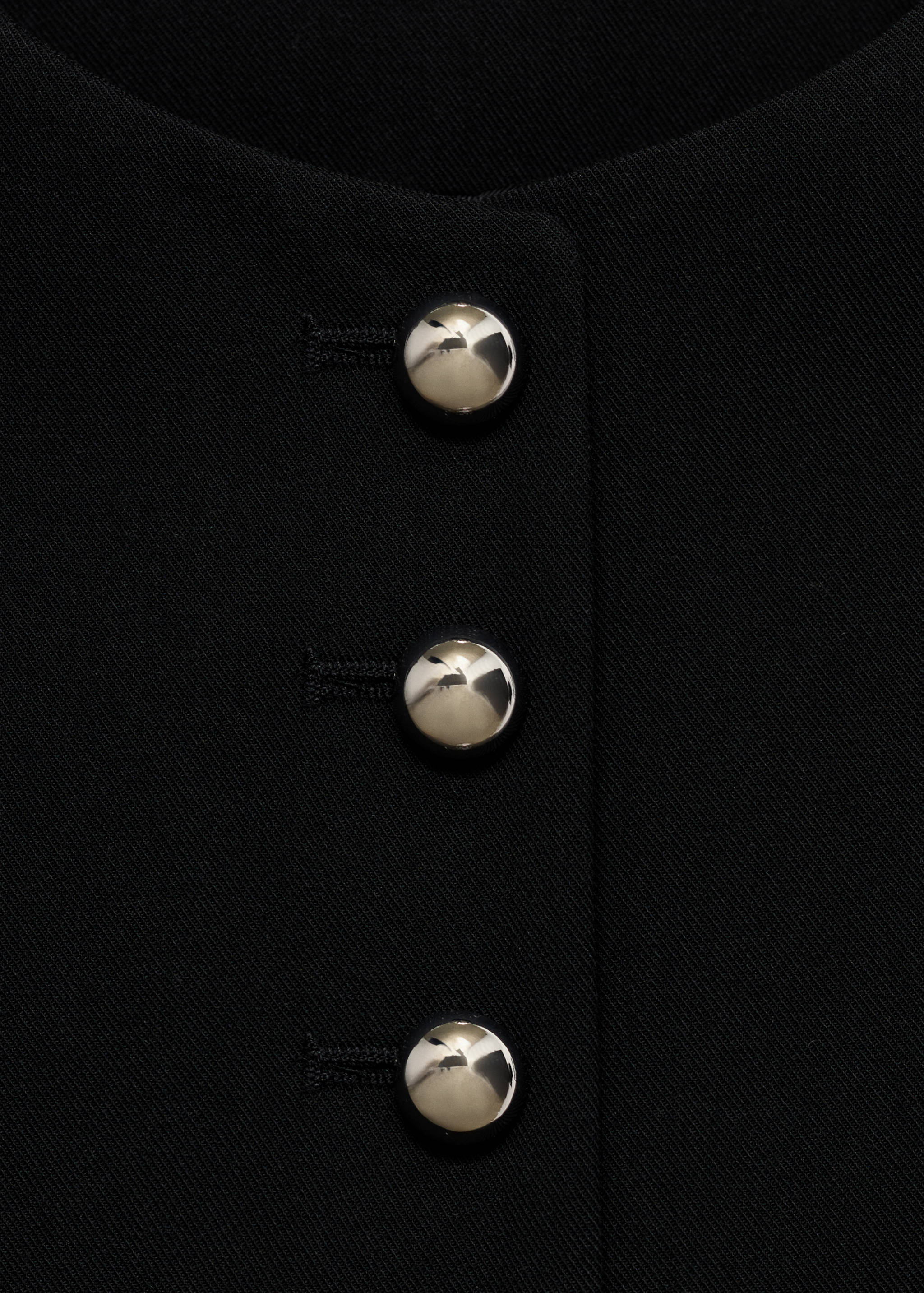 Gilet met knopen - Detail van het artikel 8