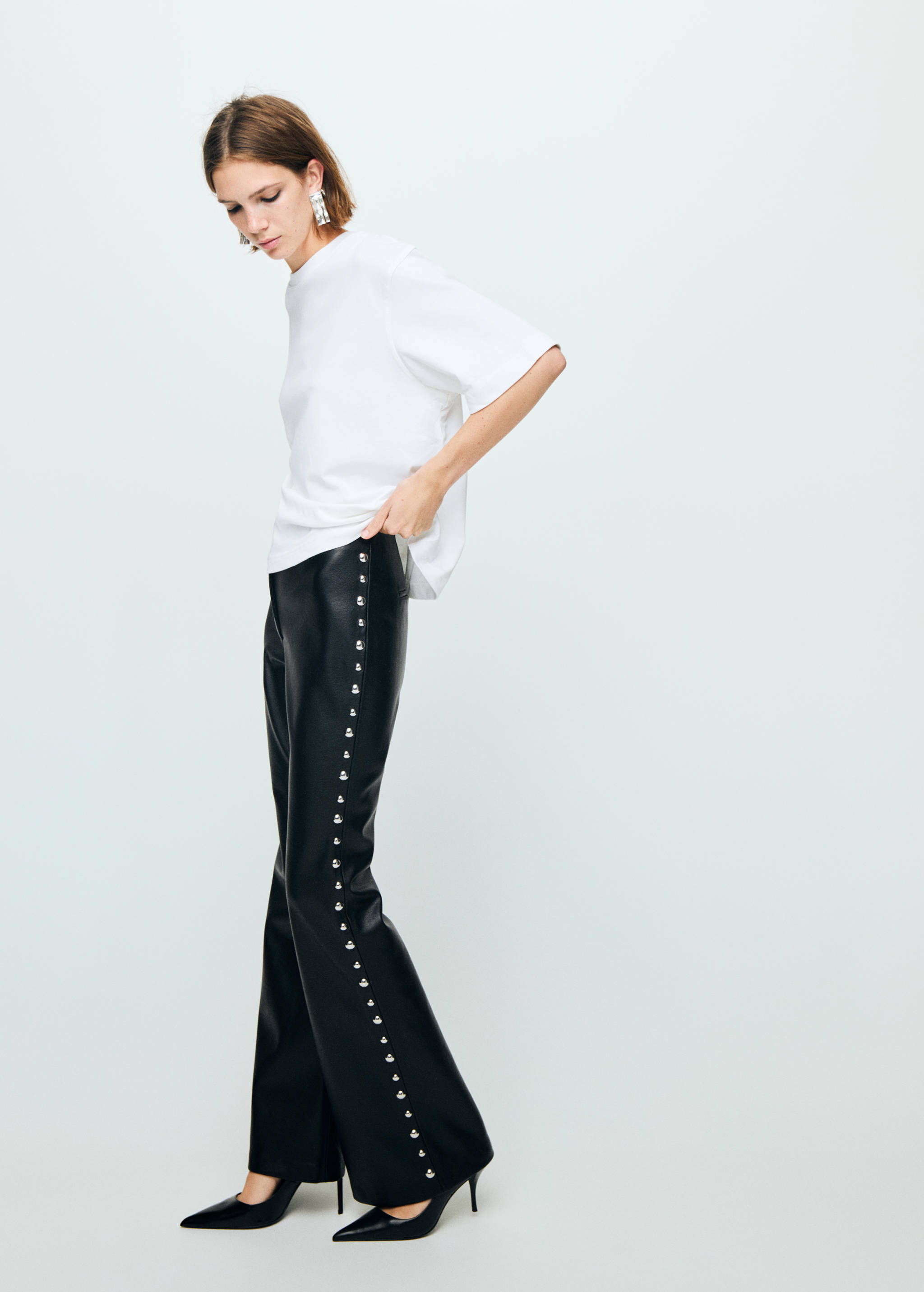 Studded faux-leather trousers - General plane