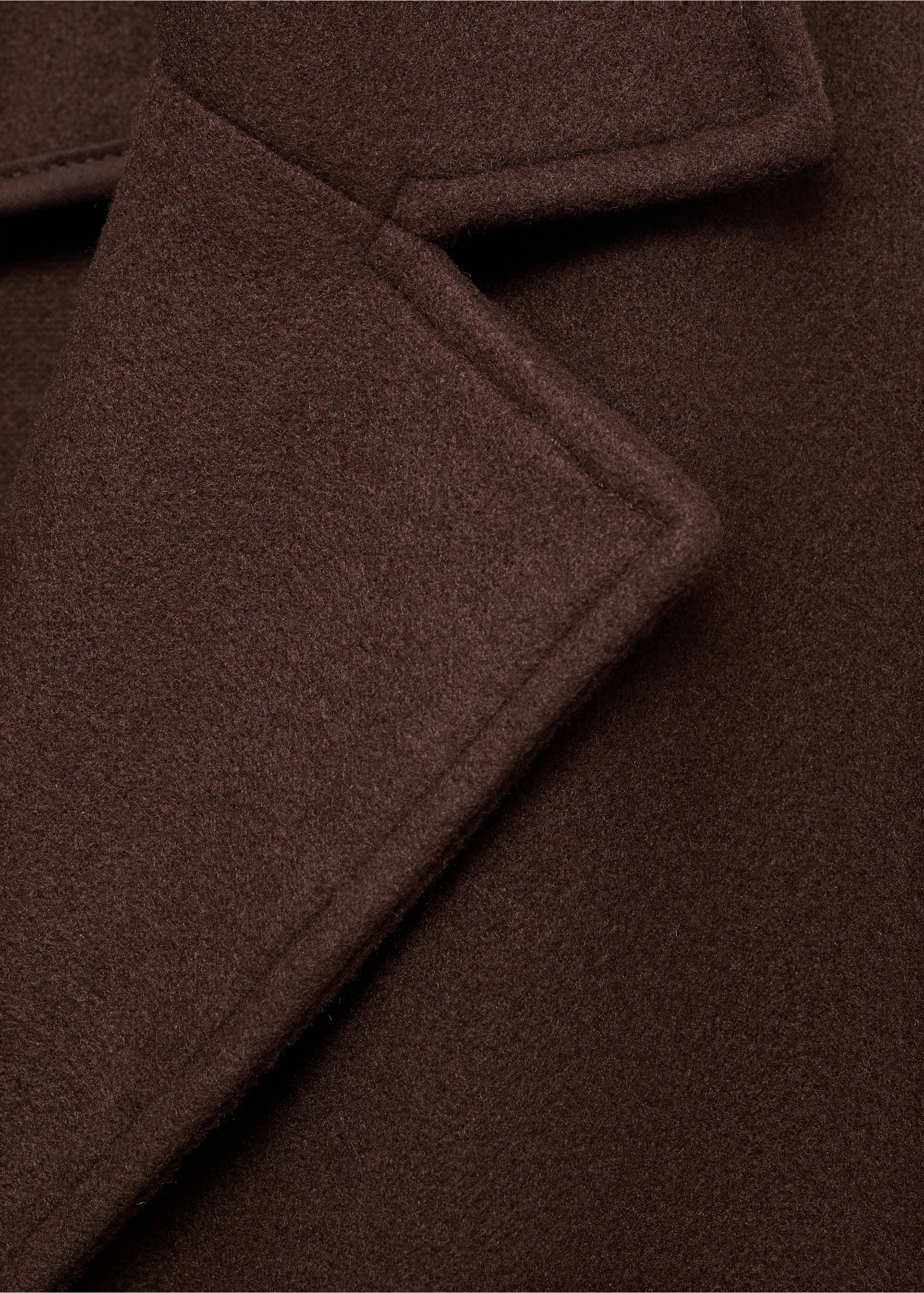 Close-up of the lapel and collar of a dark brown coat., Brown. Ref: 17095812-00.