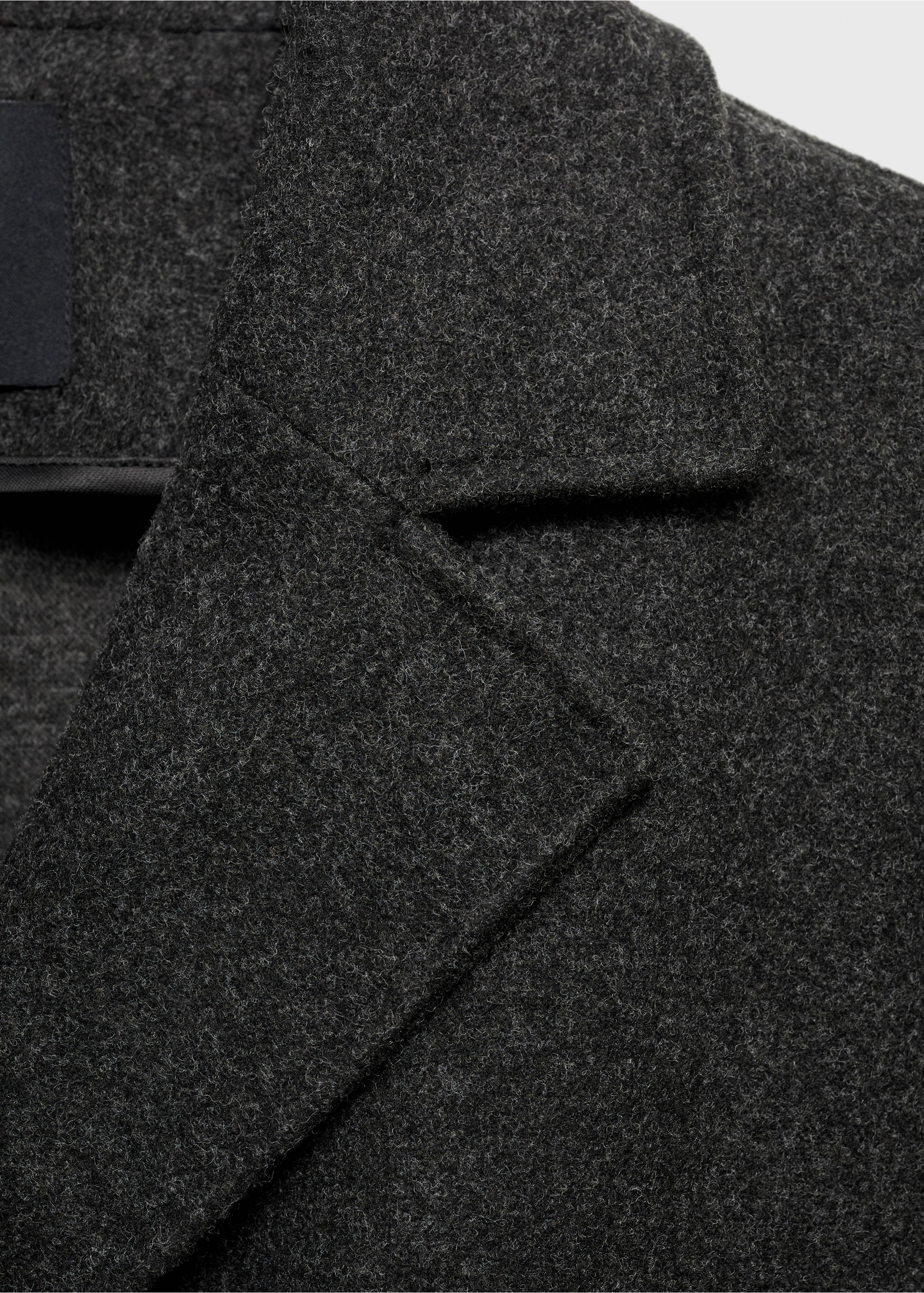 Close-up of a dark grey coat lapel and collar., Charcoal. Ref: 17095812-00.