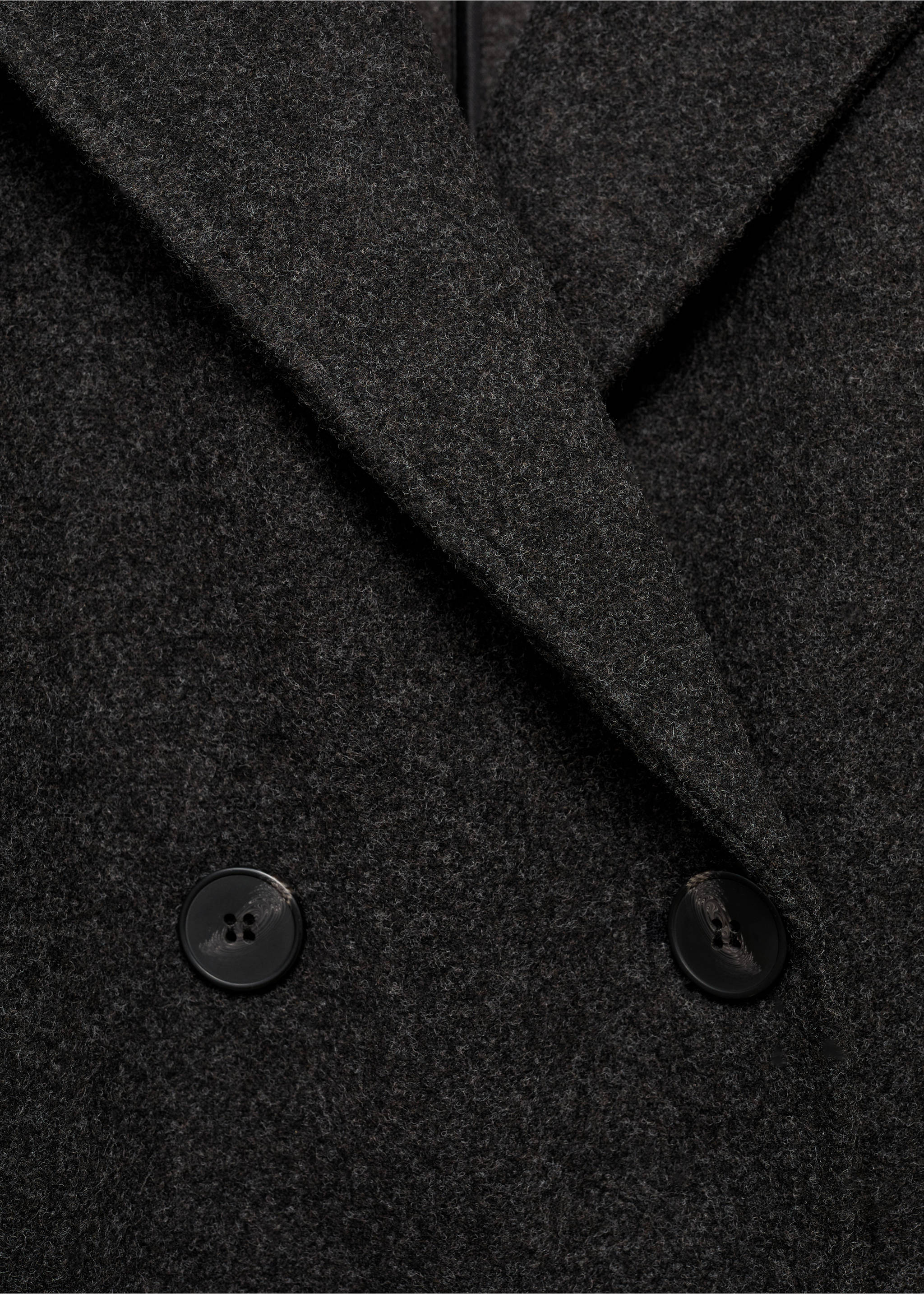 Close-up of a dark grey coat showing its textured fabric and lapels., Charcoal. Ref: 17095812-00.