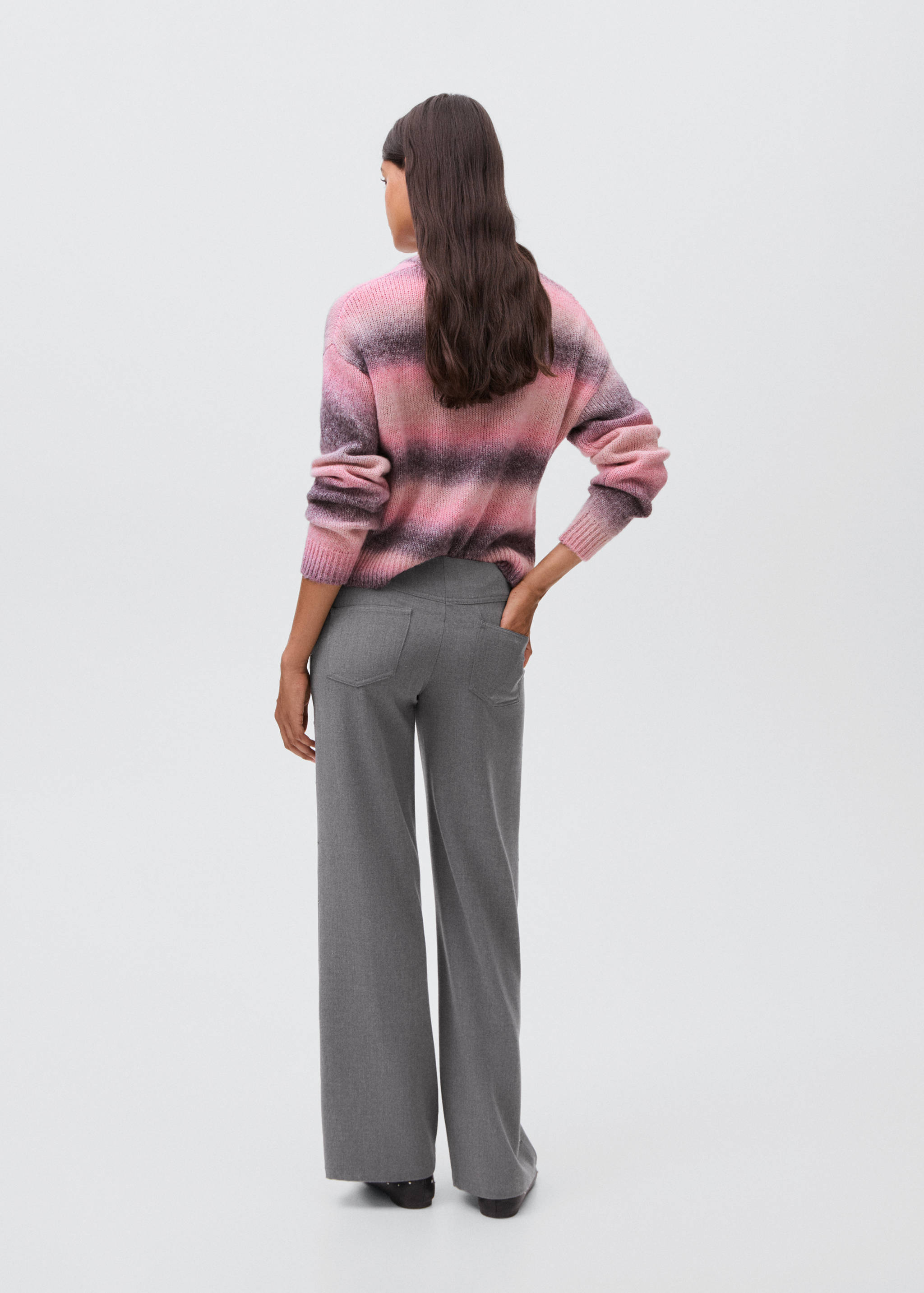 Low-waist studded pants - Reverse of the article