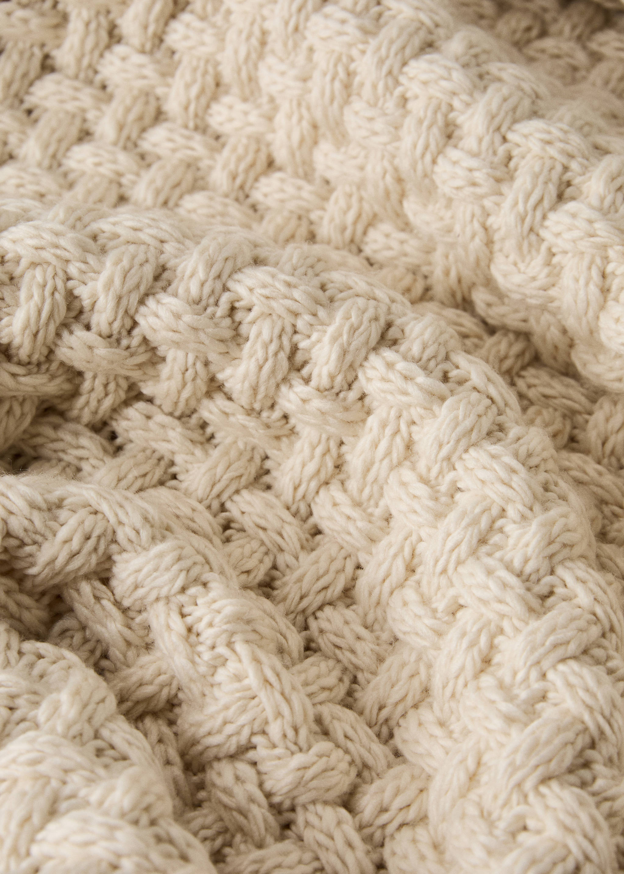 Gestrickte Decke mit Flechtmuster - Detail des Artikels 2