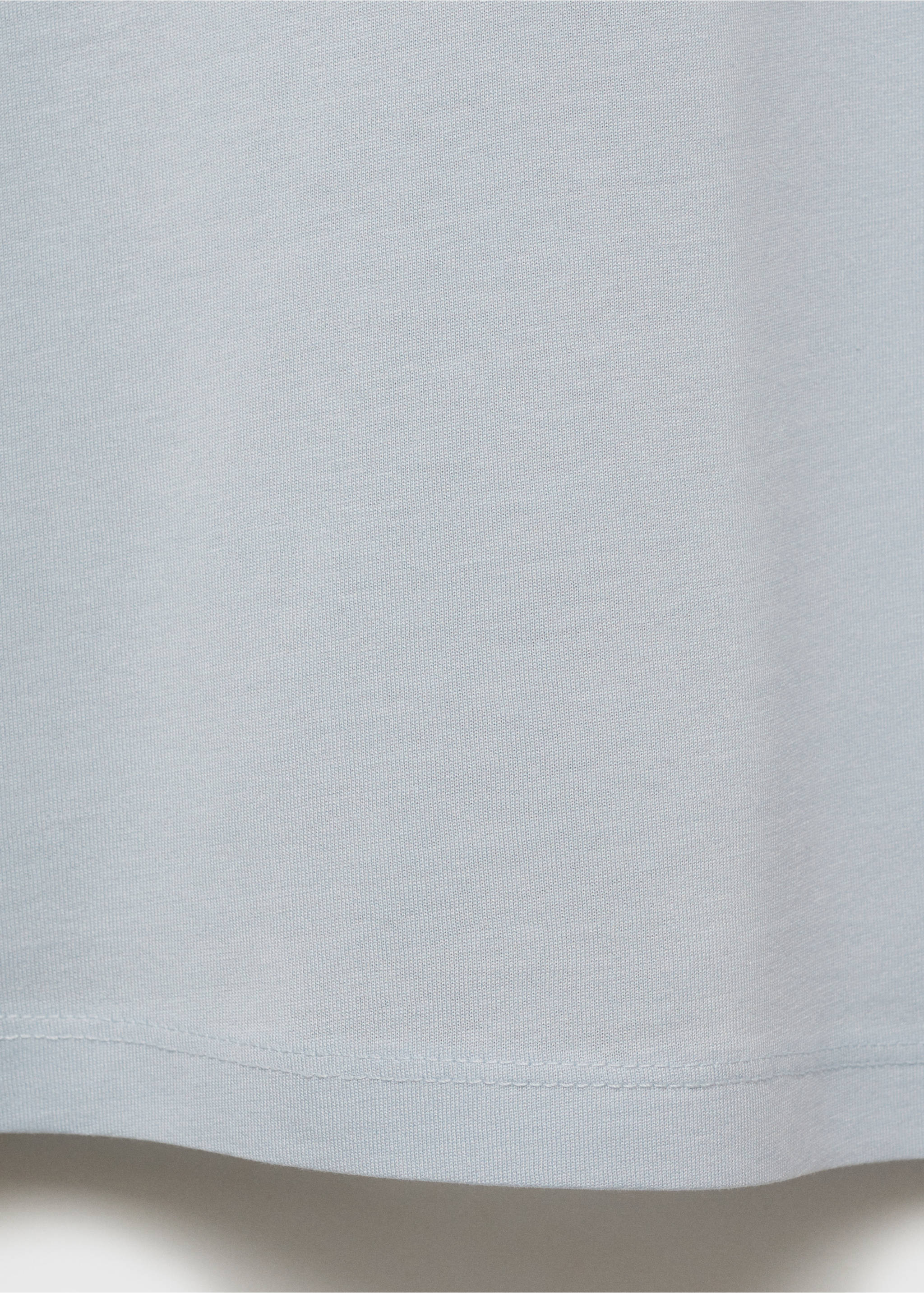 Primer plano de la textura del tejido y del dobladillo de la camiseta gris claro., Verde agua. Ref: 17860293-00.