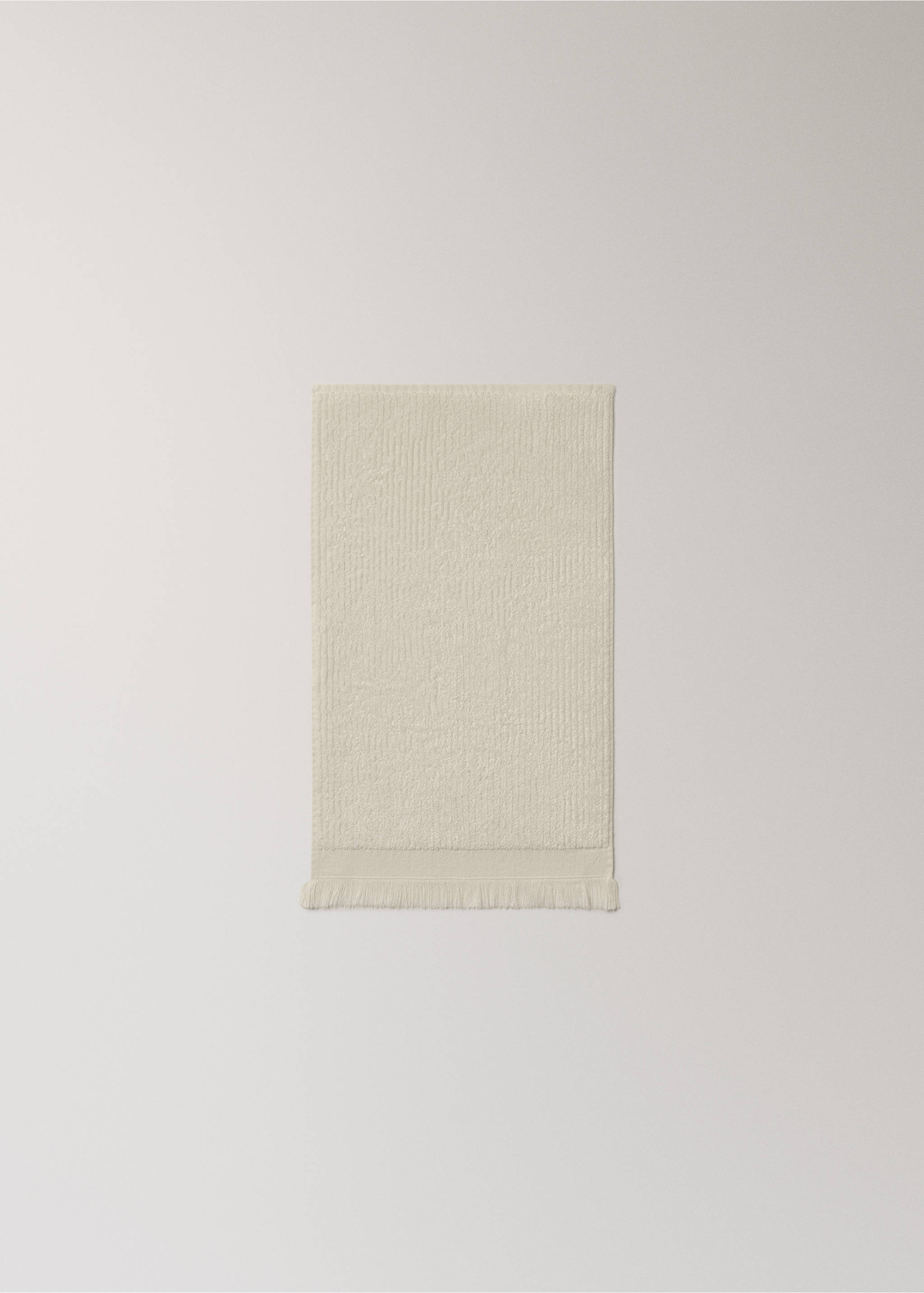Textured guest towel with fringes - Details of the article 3, Ecru. Ref: 27001563-00.