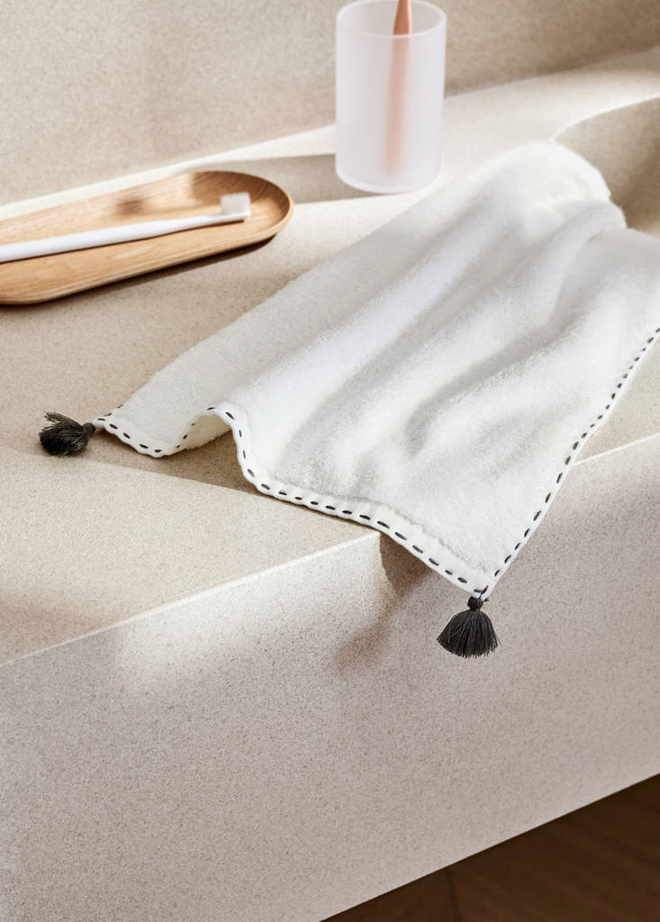 Guest towel with topstitching finish and pompom detail — Off White