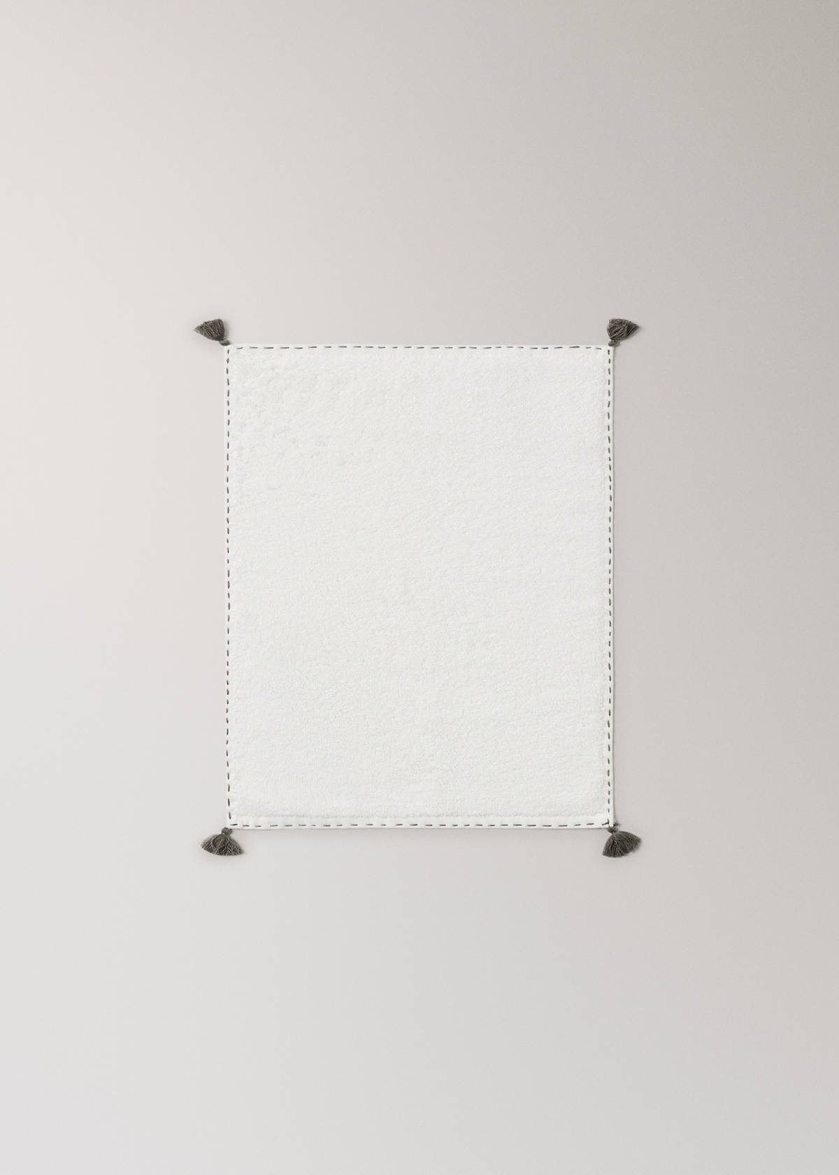 Guest towel with topstitching finish and pompom detail — Off White