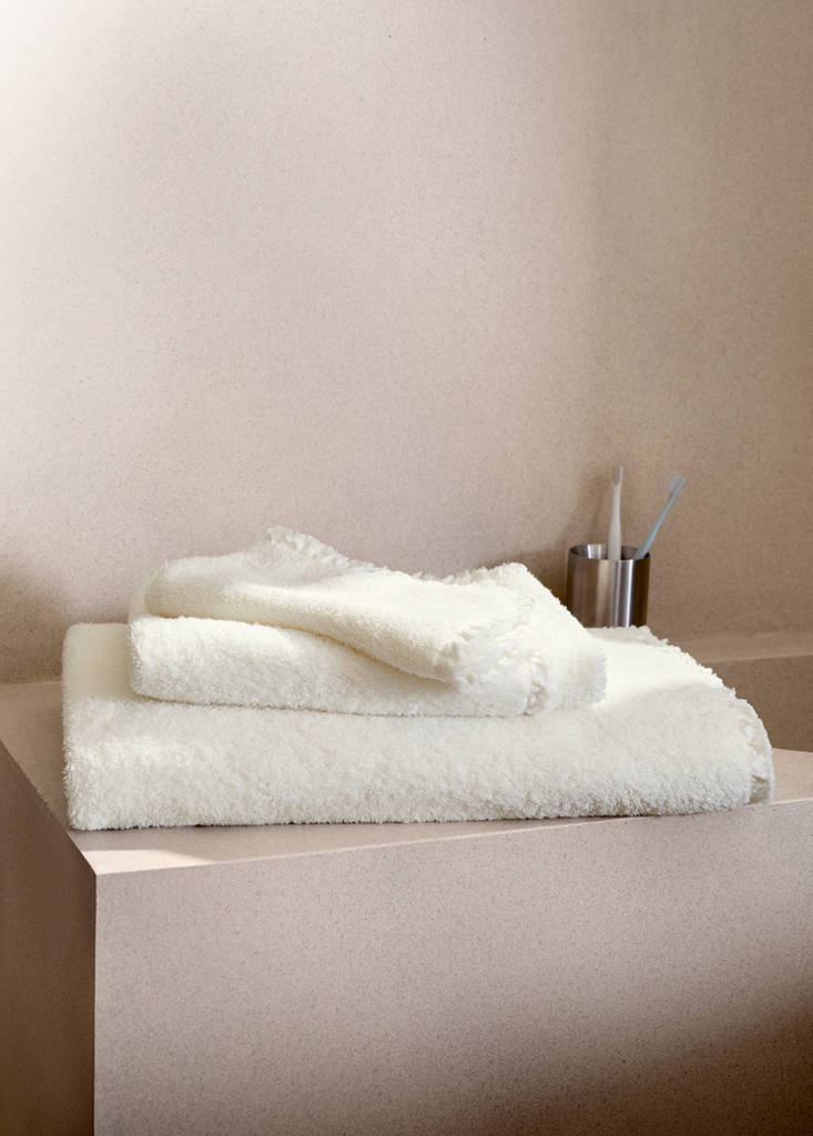Frayed edge cotton terry hand towel with frill trim — Ecru