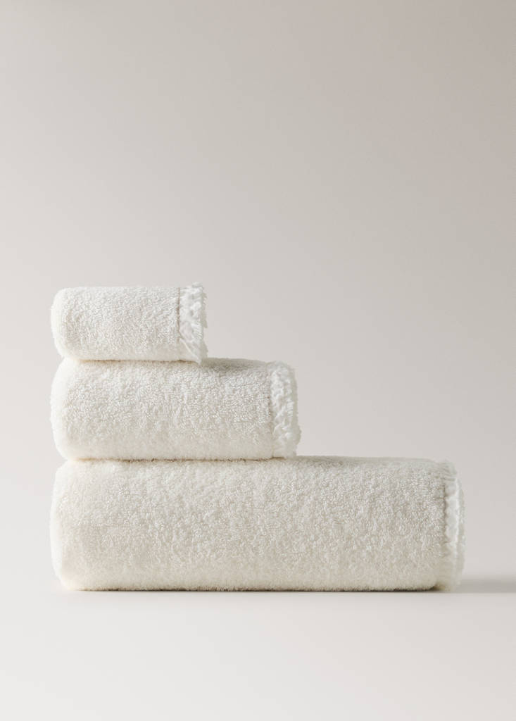 Frayed edge cotton terry hand towel with frill trim — Ecru