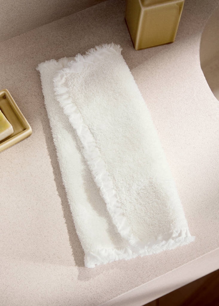 Cotton terry guest towel with frayed edge and ruffle