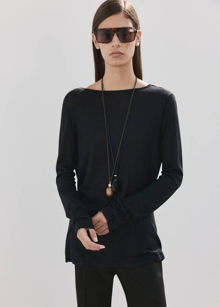 Knit sweater with draped back