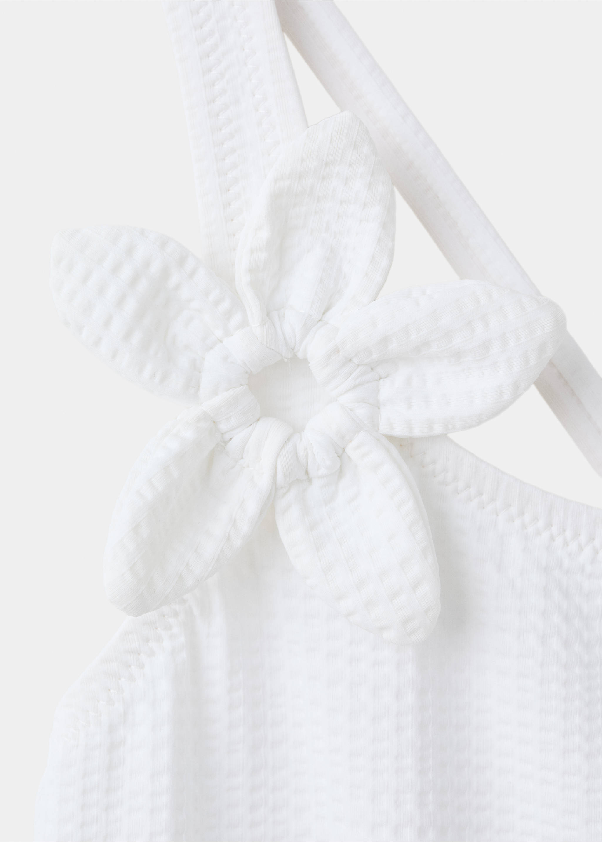 Asymmetric swimsuit with raised flower - Details of the article 8, White. Ref: 27017898-00.