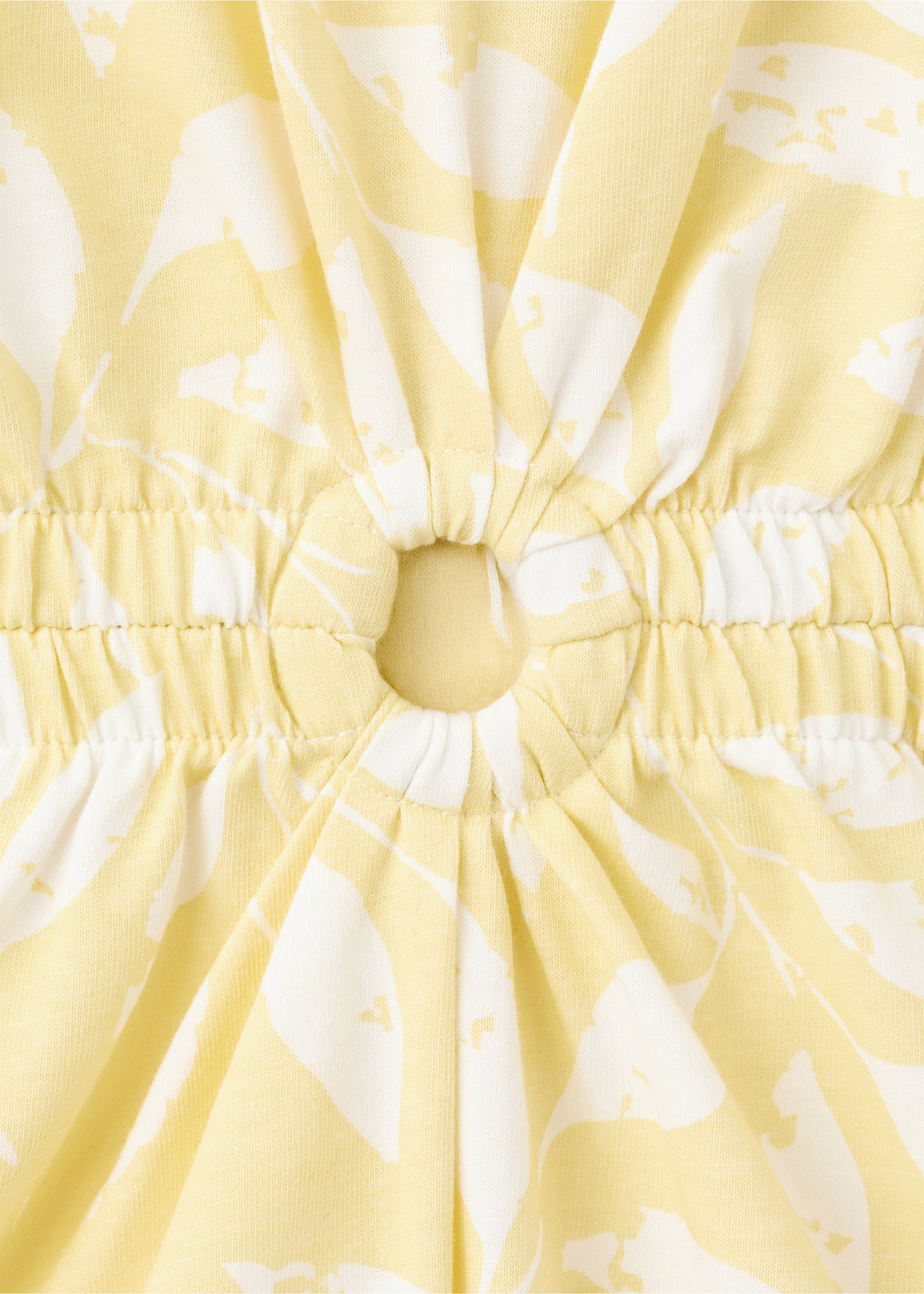 Printed jumpsuit with openings - Details of the article 8, Pastel Yellow. Ref: 27018666-00.