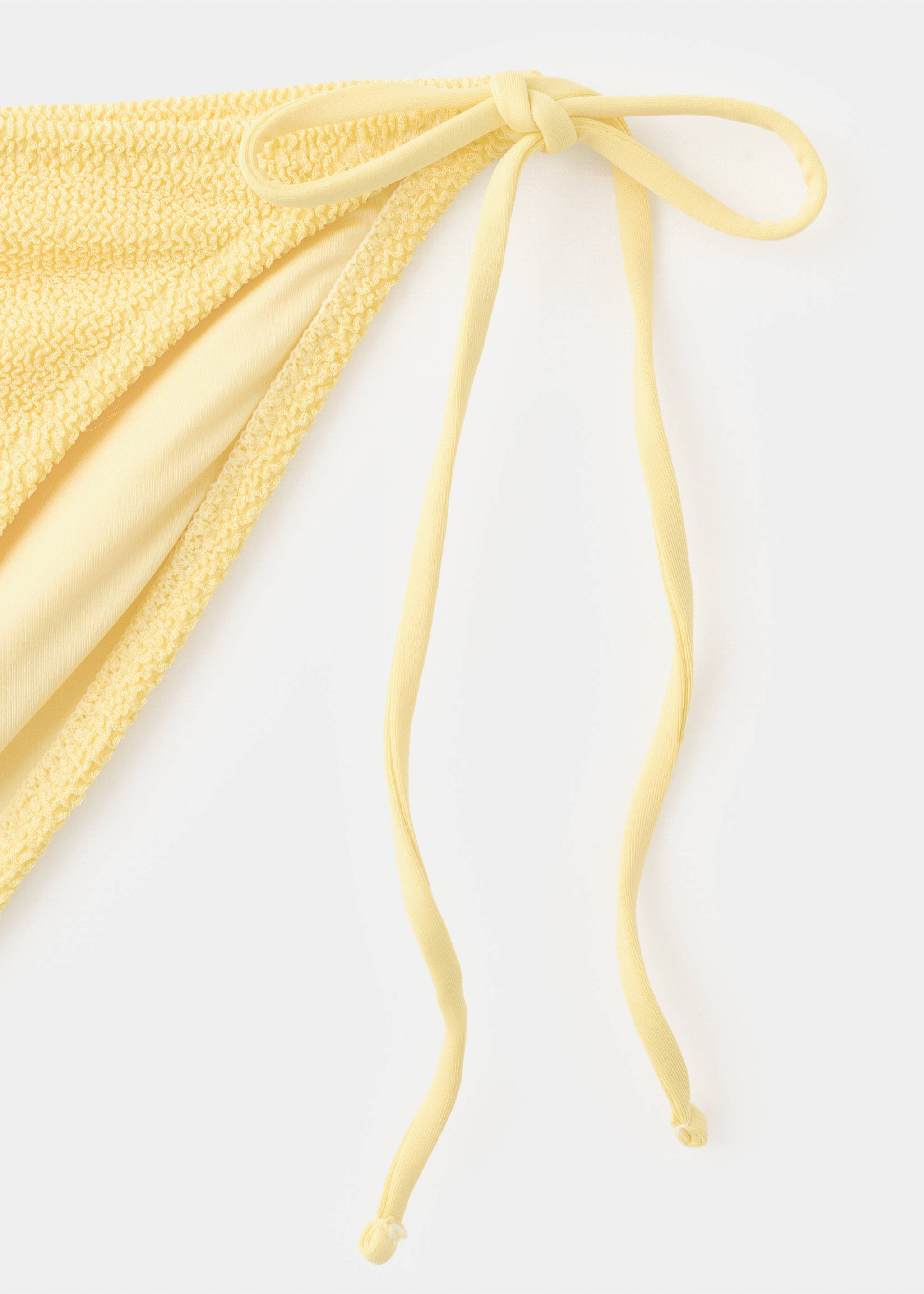 Classic textured bikini briefs - Details of the article 8, Pastel Yellow. Ref: 27019411-00.