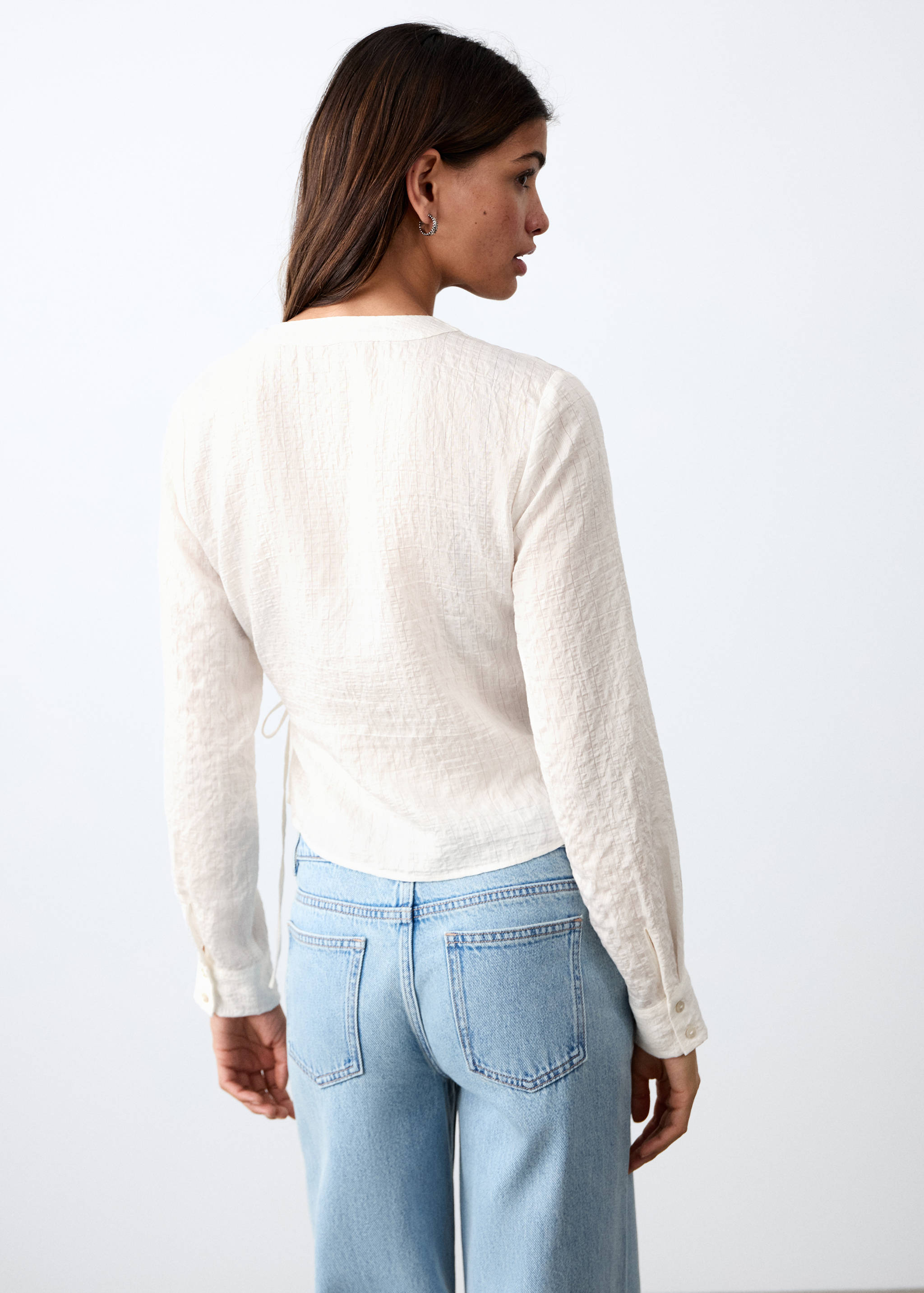 Double-breasted blouse with bow - Reverse of the article