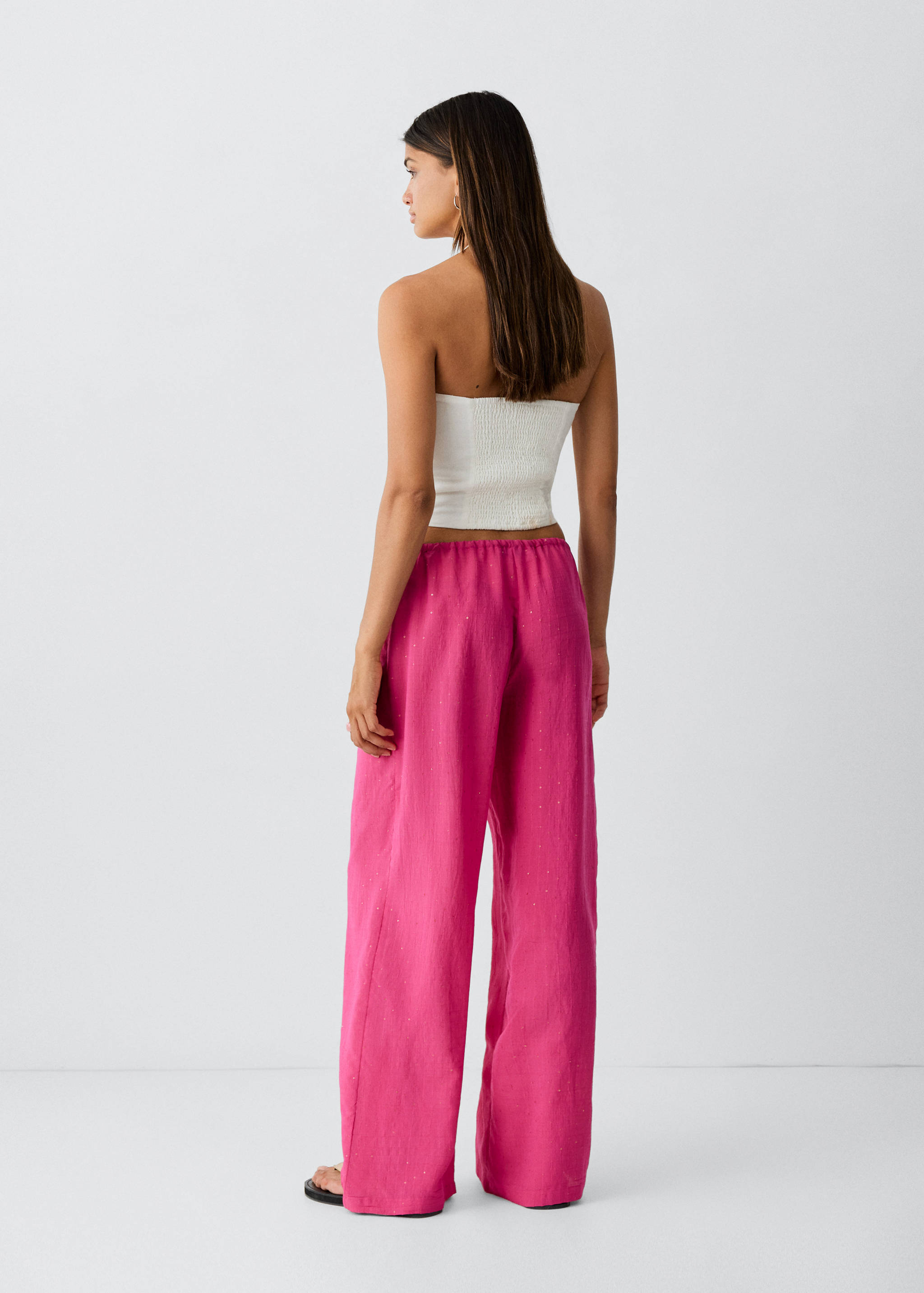 Straight-leg trousers with rhinestones - Reverse of the article