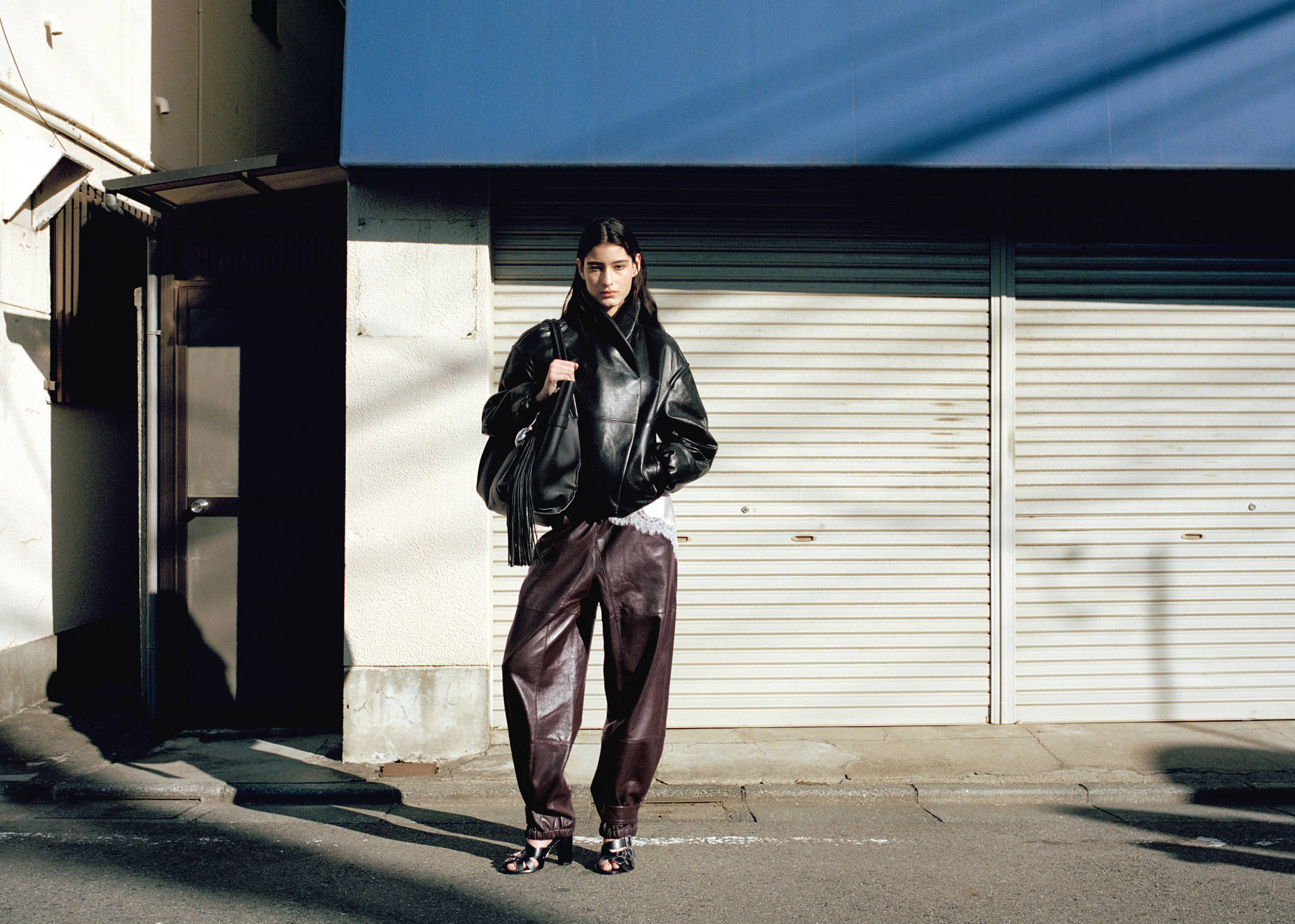Buttoned hem leather trousers - Panoramic plane