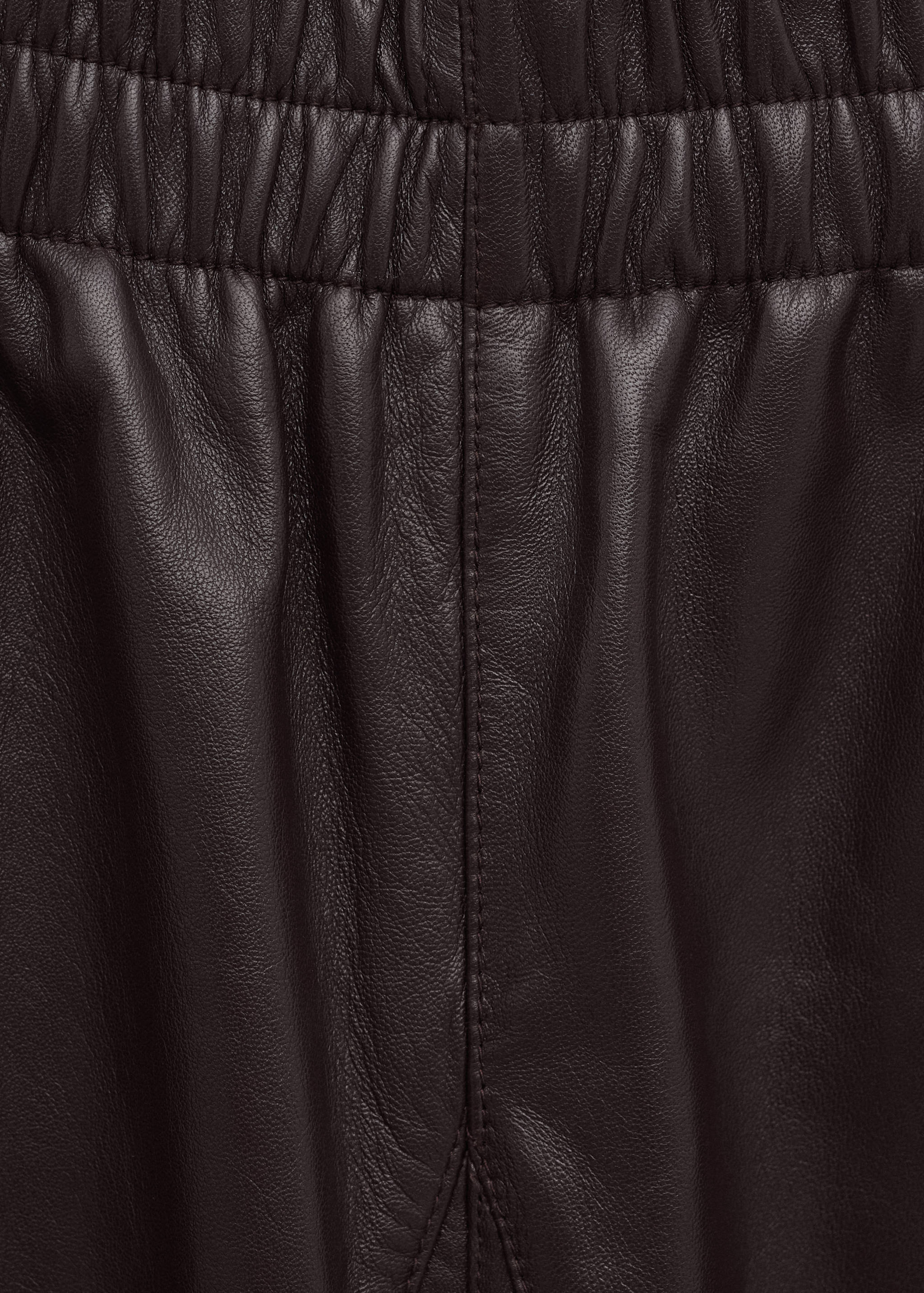 Buttoned hem leather trousers - Details of the article 8