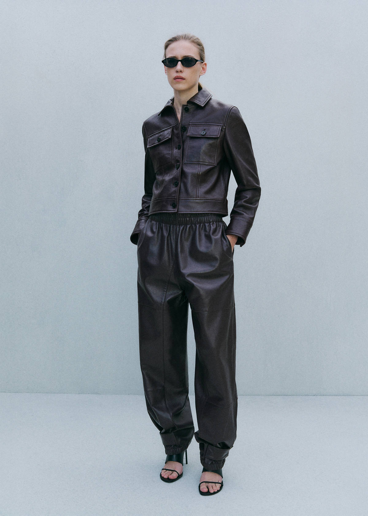 Buttoned hem leather trousers — Burgundy
