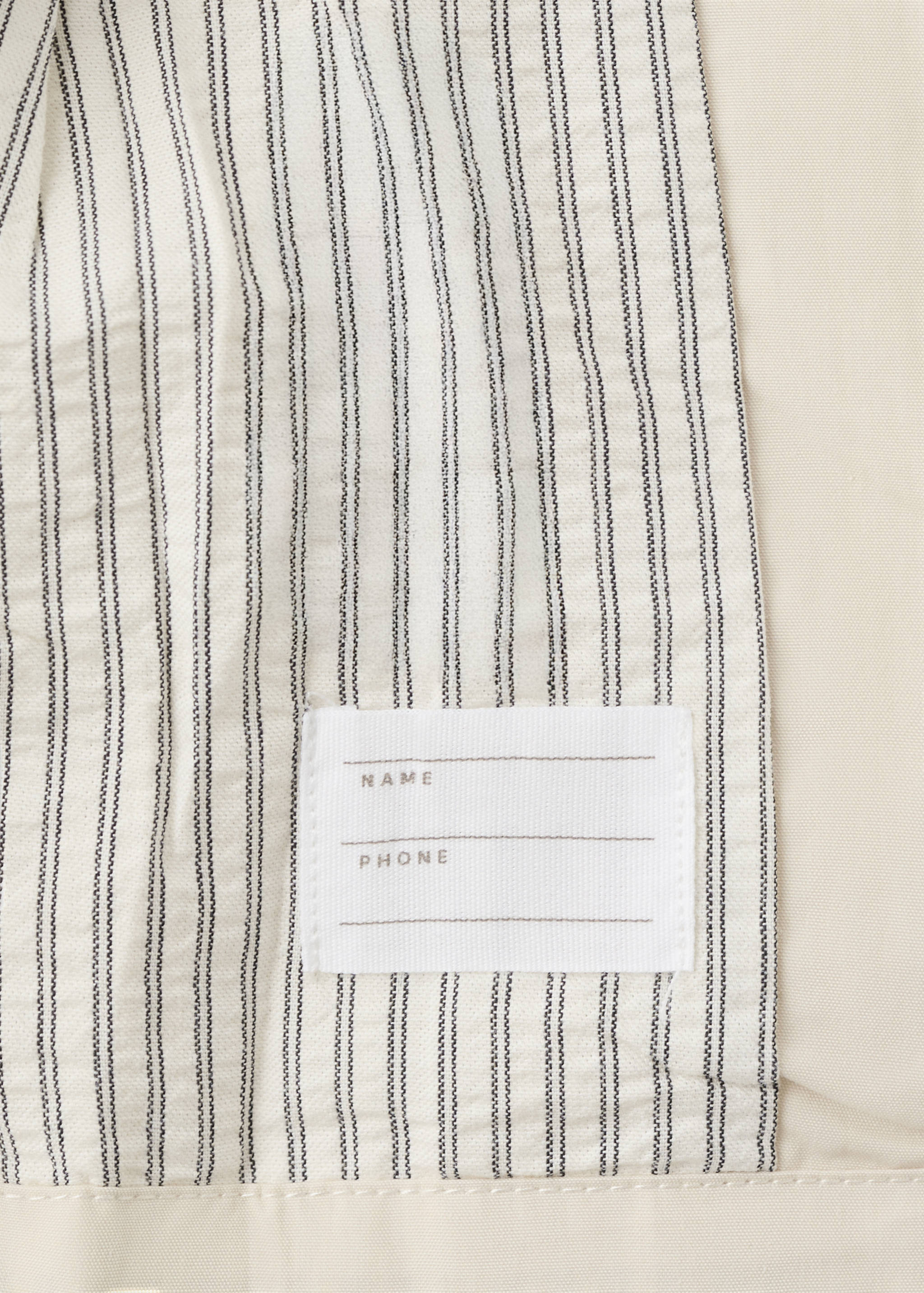 Rubberised jacket with tie - Details of the article 0