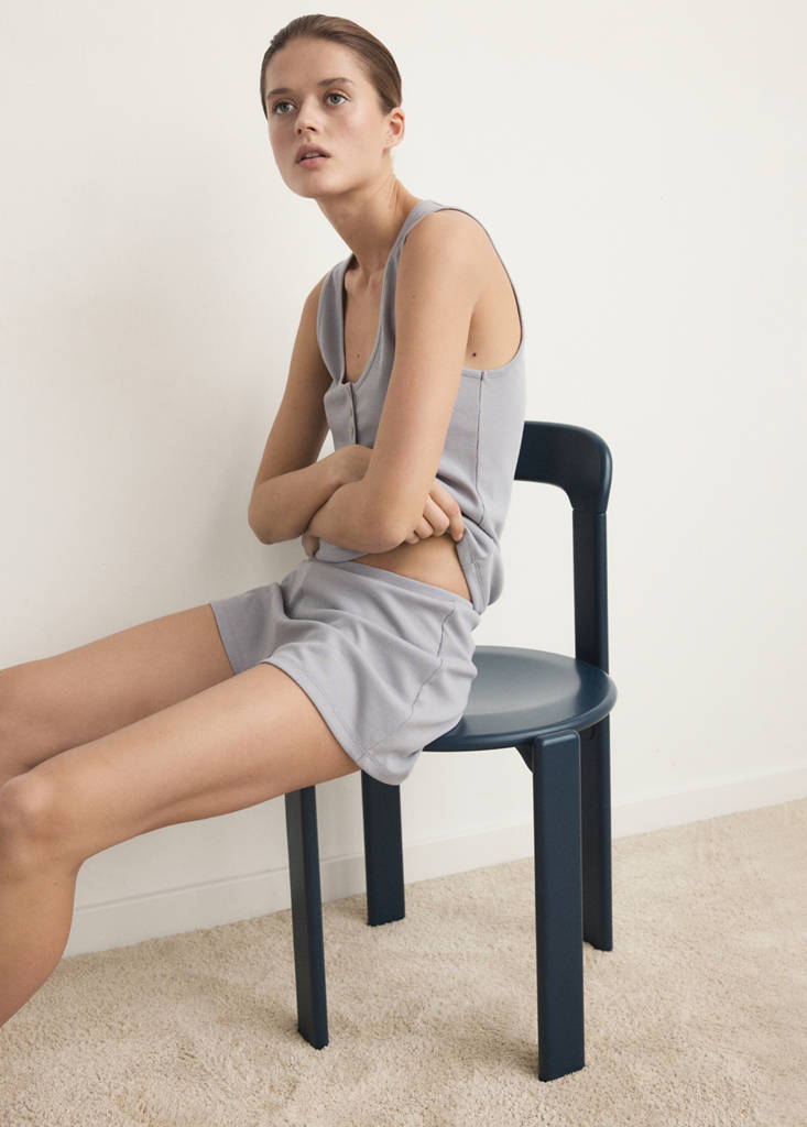 Sleeveless top with round neckline and button detail — Grey