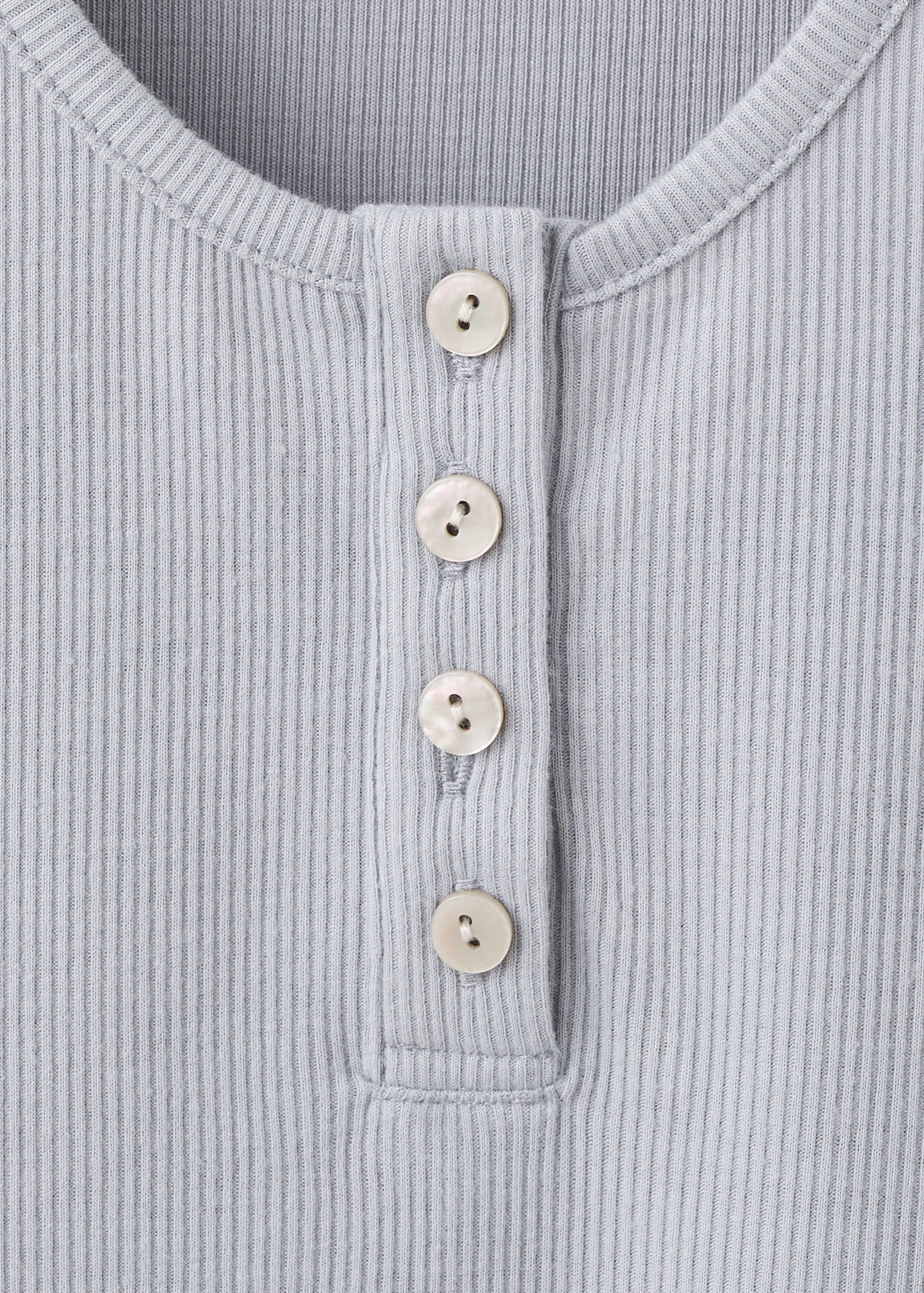 Sleeveless top with round neckline and button detail - Details of the article 8