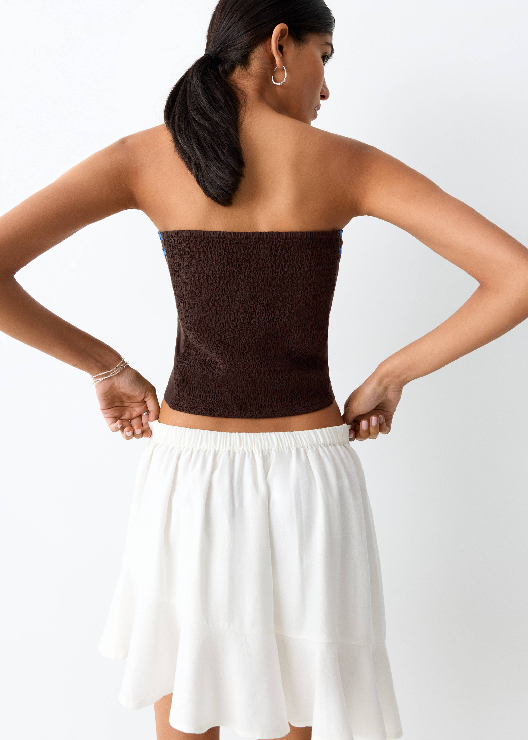 Top bandeau detalls contrast - Revers de l'article