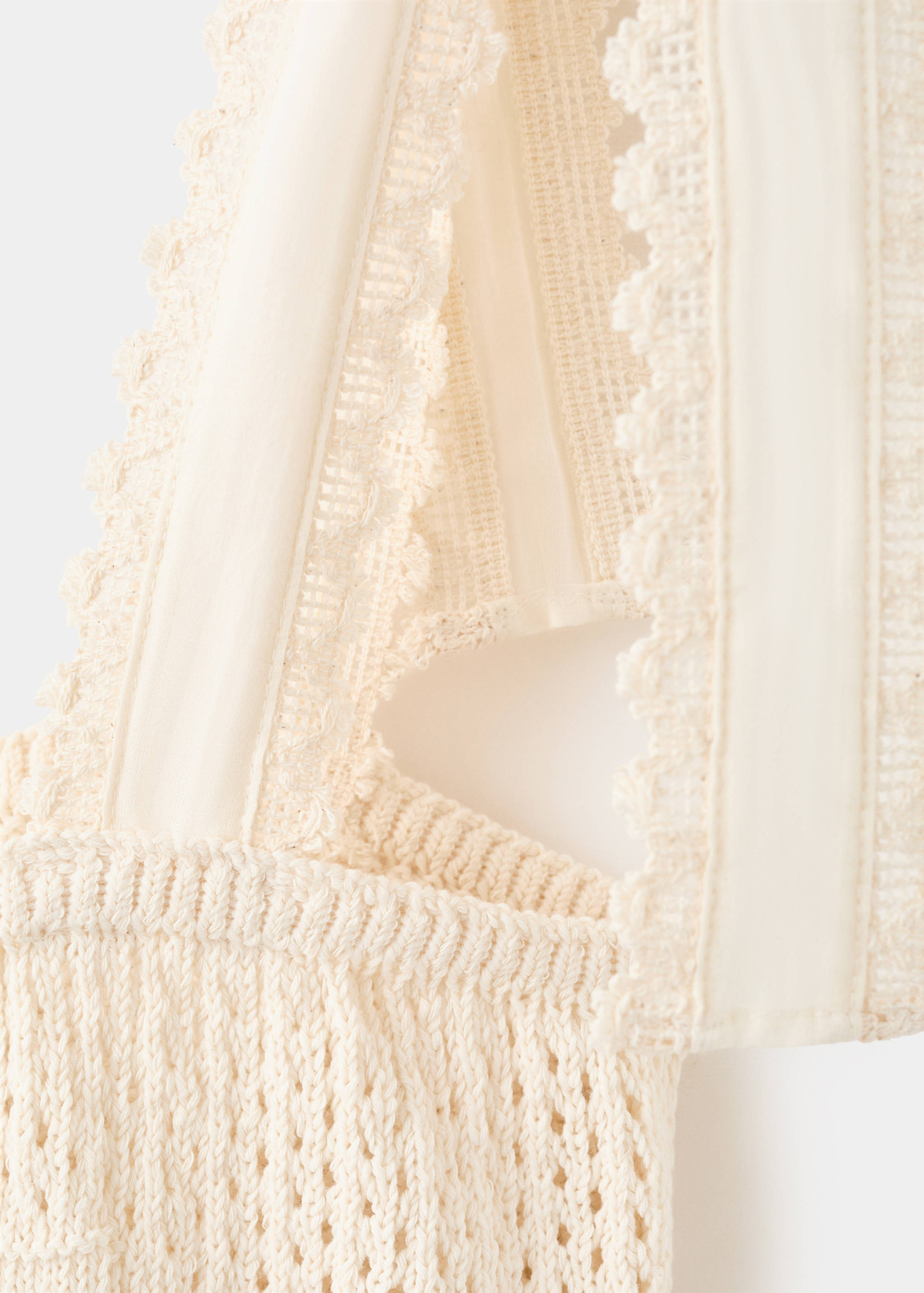 Openwork knitted top with bows - Details of the article 0