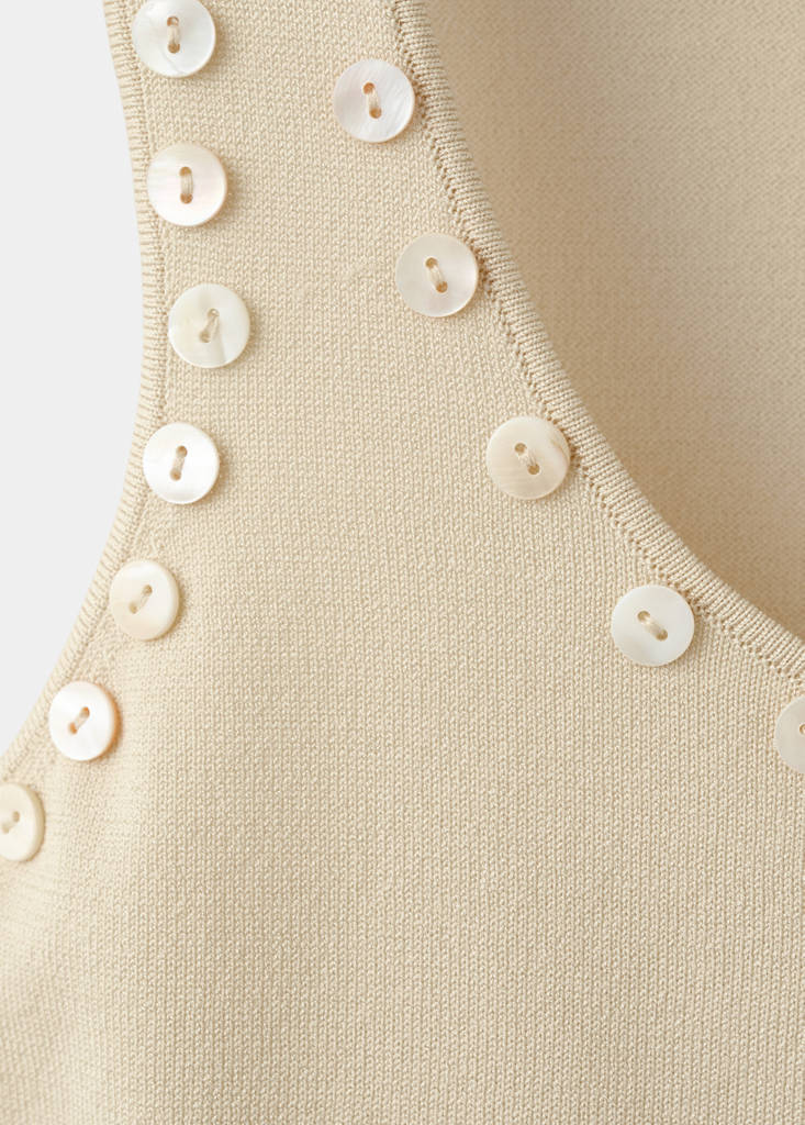 Sleeveless top with decorative buttons — Ecru
