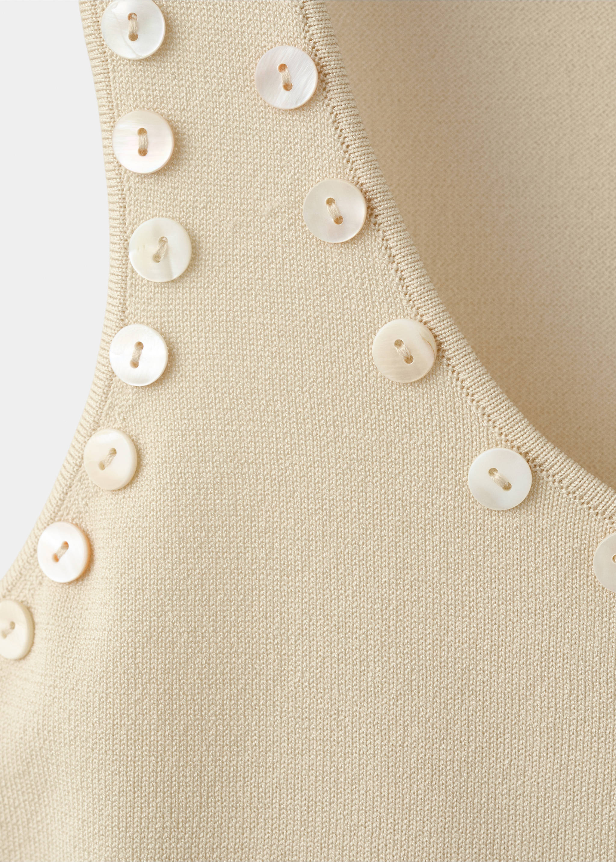 Sleeveless top with decorative buttons - Details of the article 8, Ecru. Ref: 27059060-00.