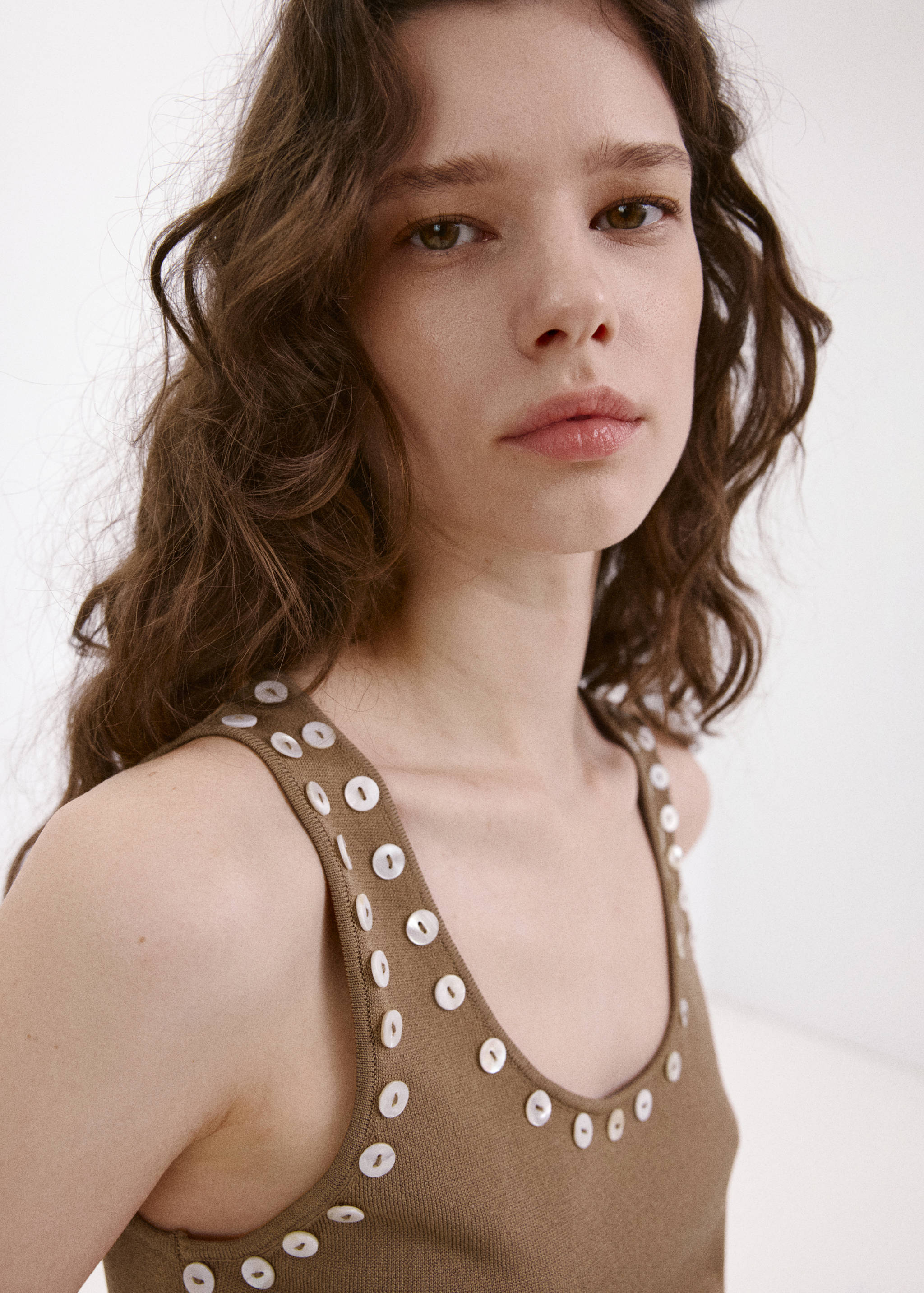 Sleeveless top with decorative buttons - Details of the article 1