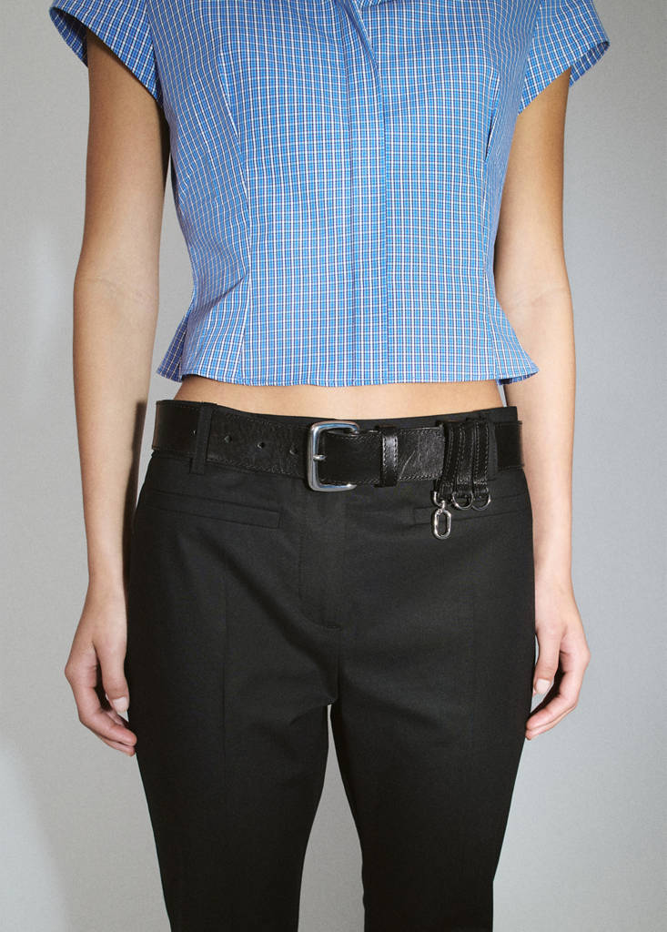 Flared trousers with piped pockets
