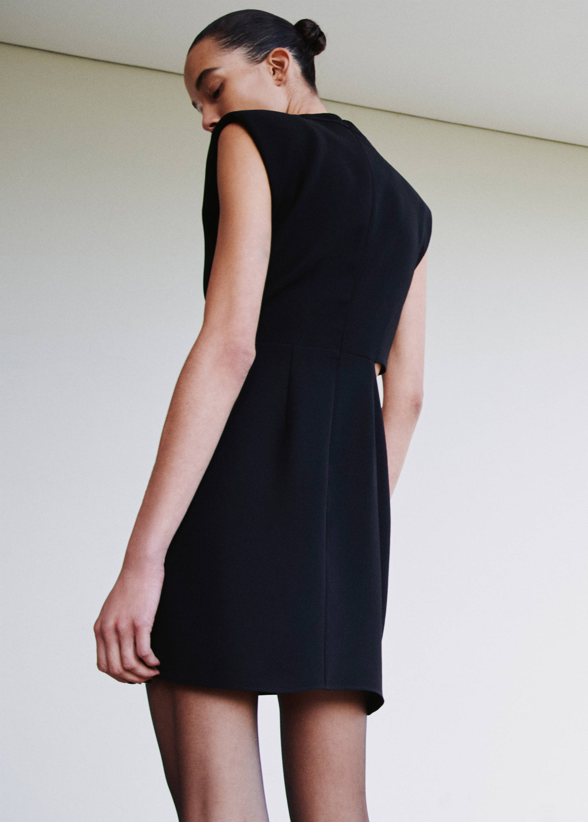 Dress with metal embellishment and cut-out - Reverse of the article