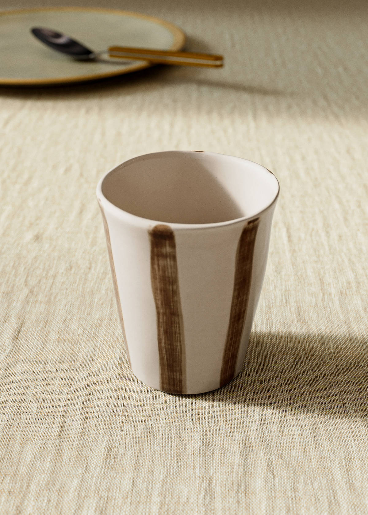 Striped stoneware coffee cup — Russet