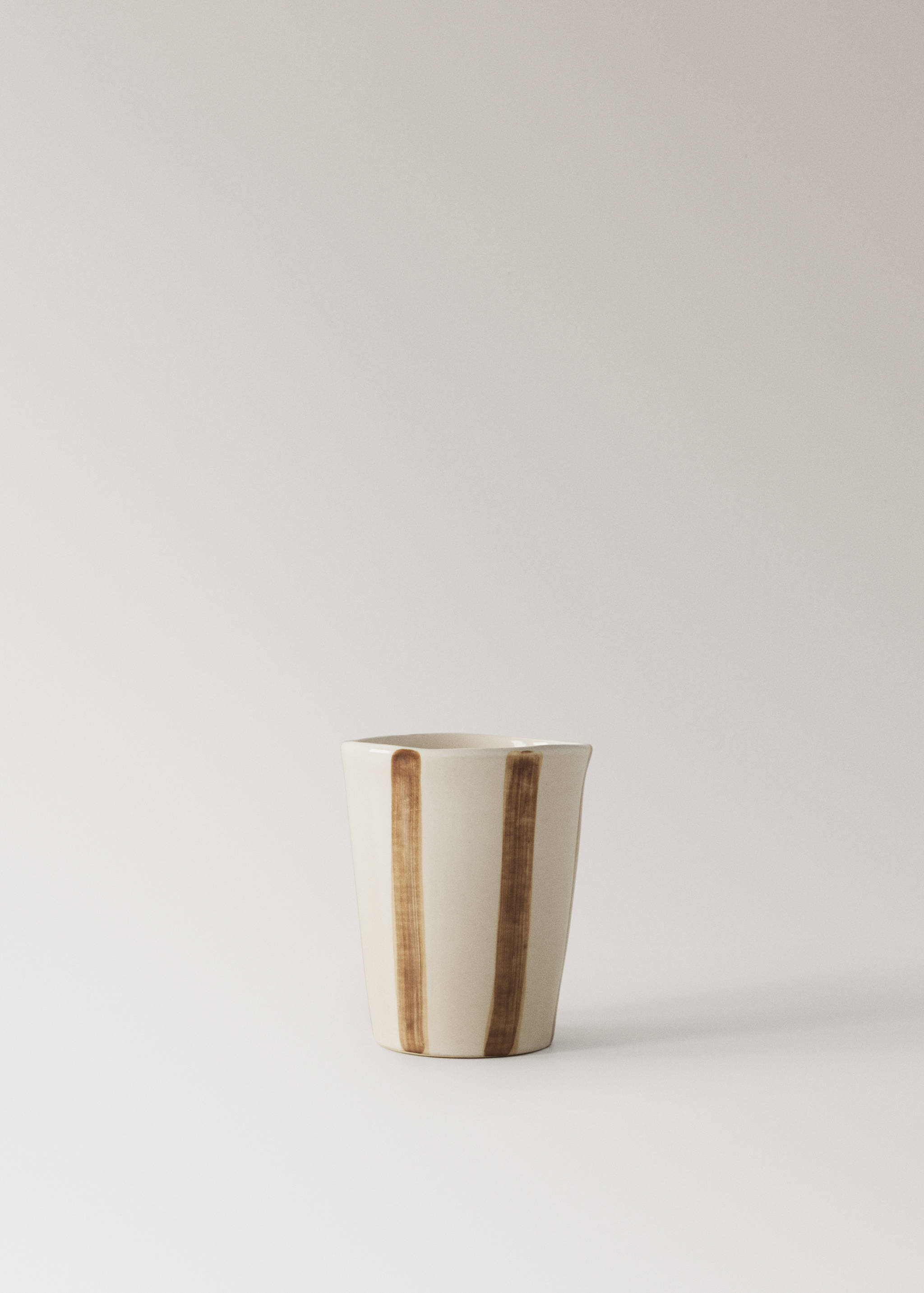 Striped stoneware coffee cup - Article without model