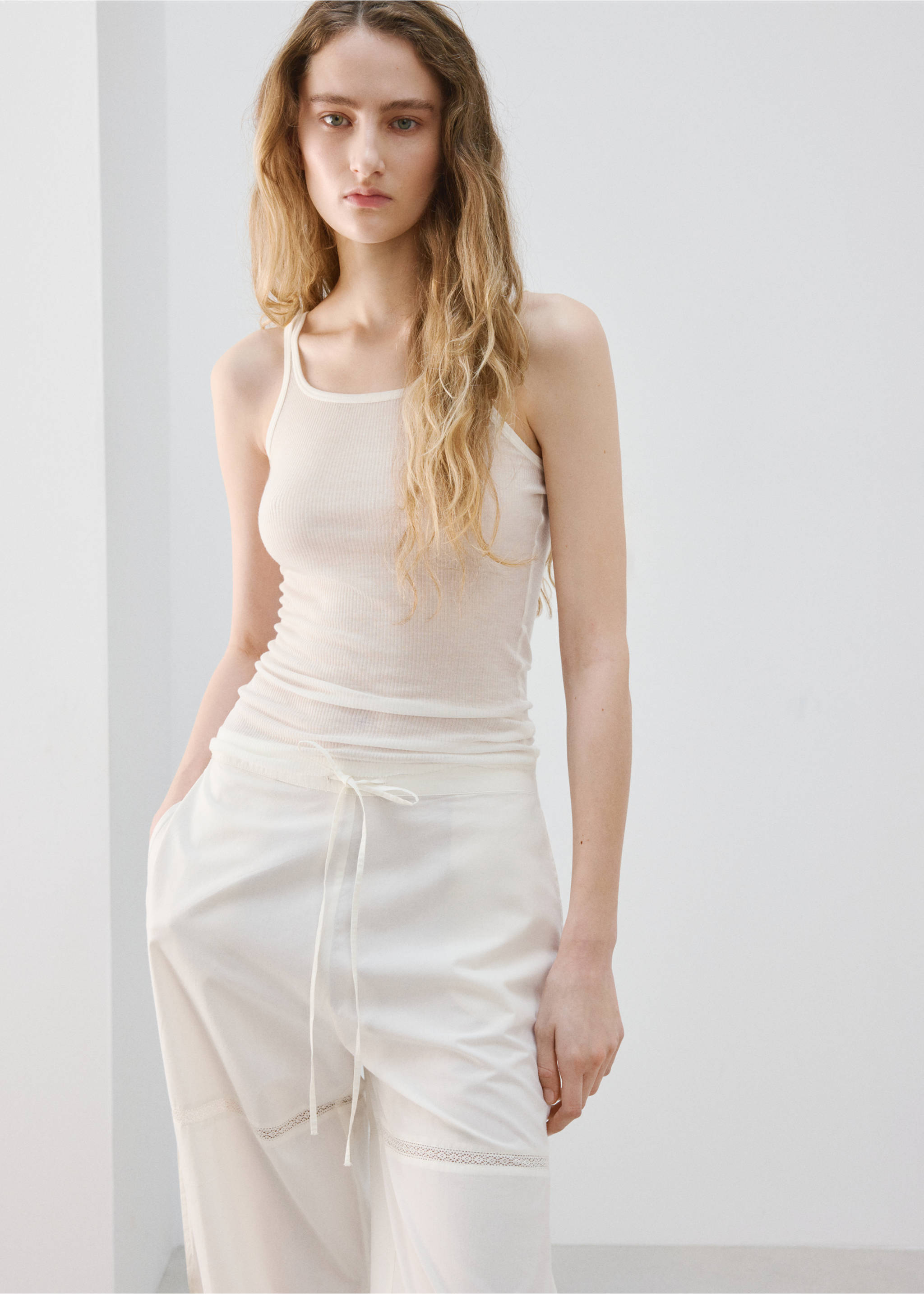 Cotton baggy trousers with bows - Details of the article 1, Ivory White. Ref: 27063331-00.