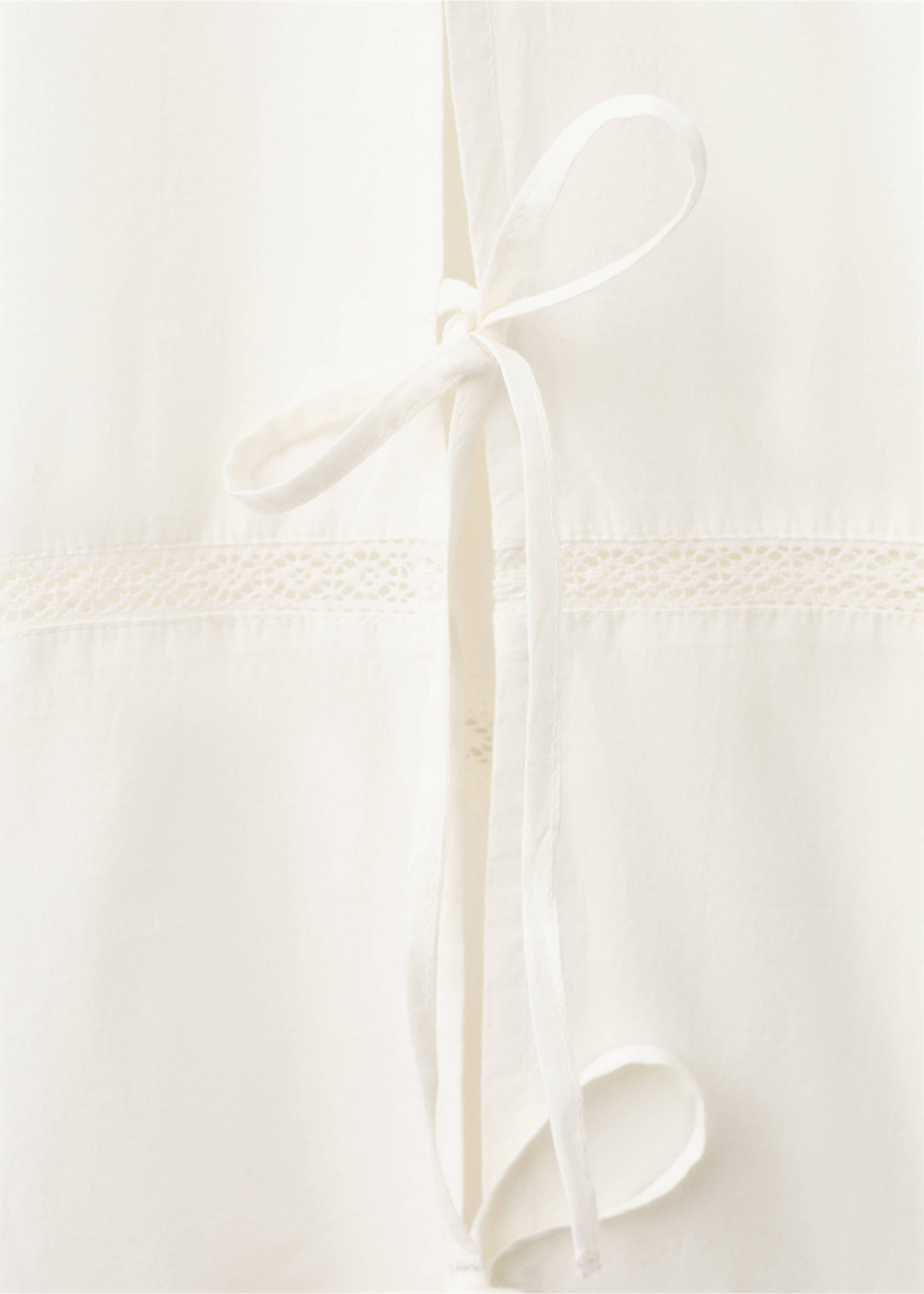 Cotton baggy trousers with bows - Details of the article 8, Ivory White. Ref: 27063331-00.