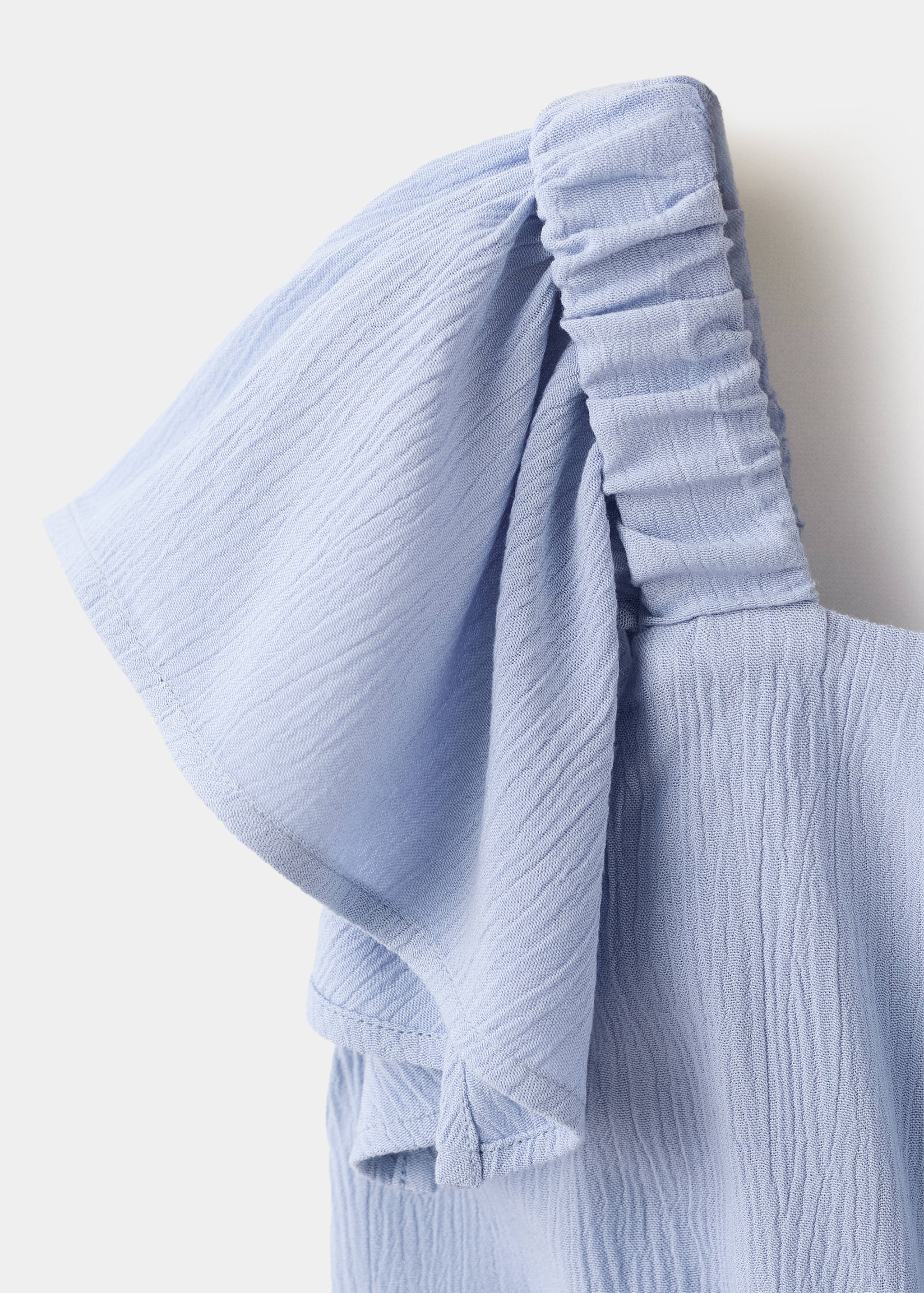 Textured playsuit with ruffled sleeves - Details of the article 8