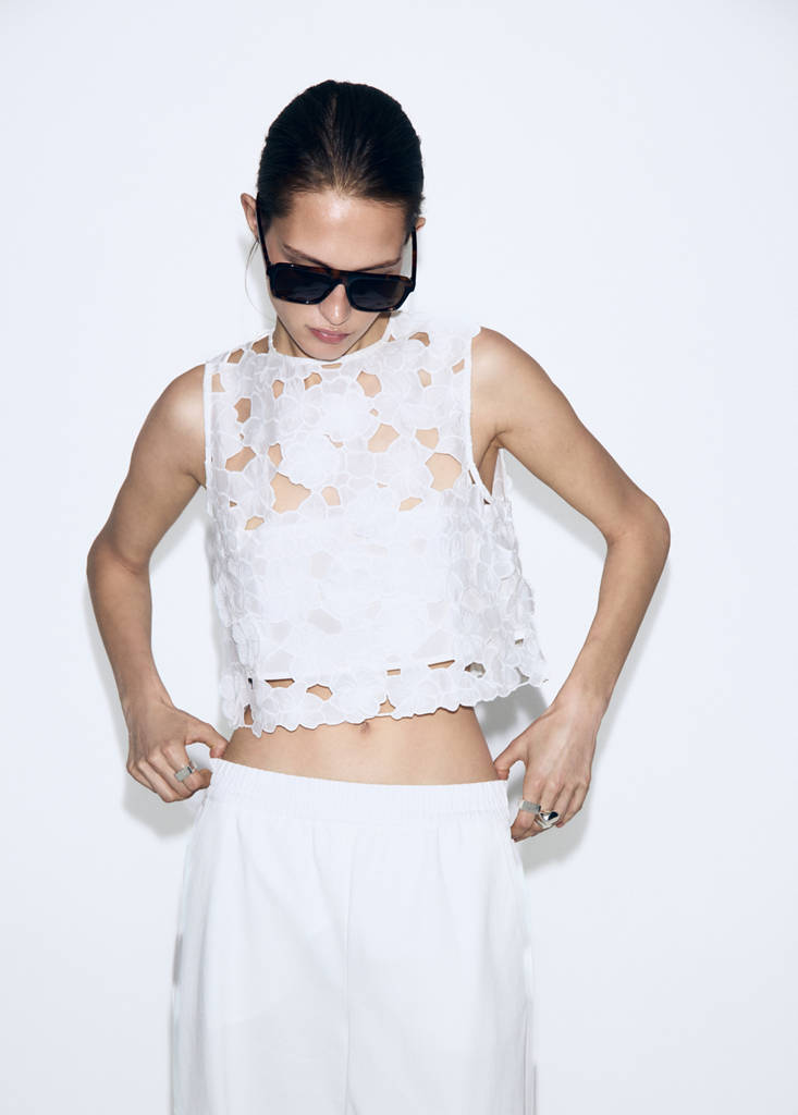 Top with openwork embroidery