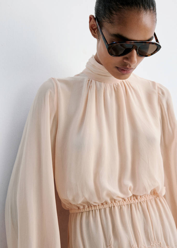 Flowing dress with embroidered details
