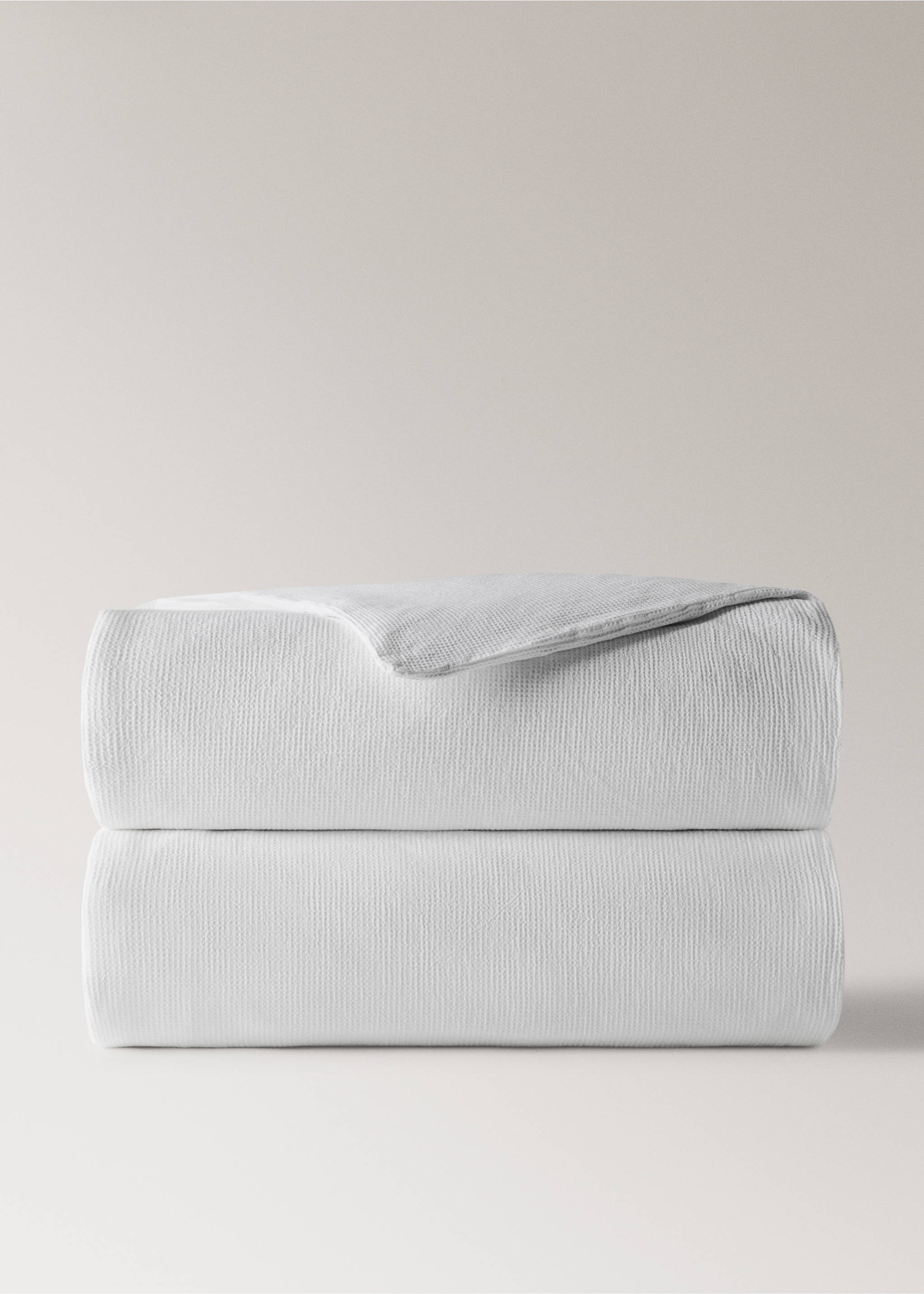 White duvet cover with a subtle textured finish, neatly folded in a still-life view., Off White. Ref: 27073718-00.