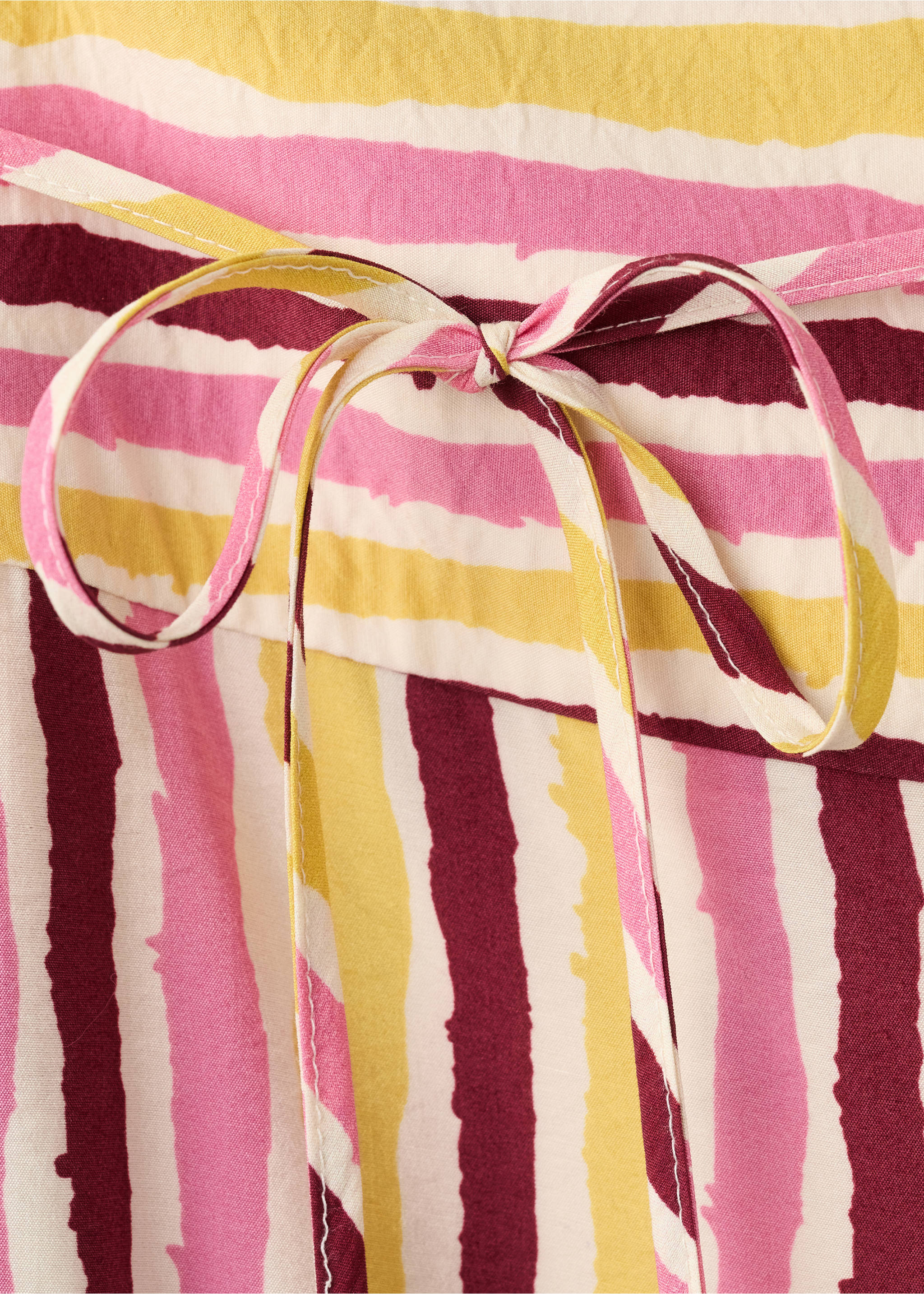 Fluid trousers with combined stripes - Details of the article 8, Mustard. Ref: 27076735-00.