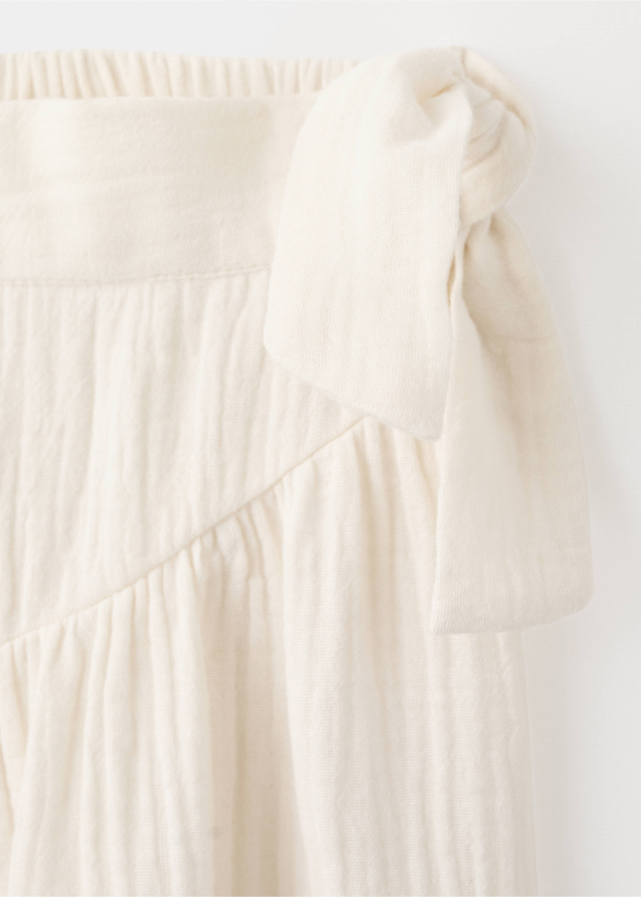 Calças com detalhe de laço lateral - Pormenor do artigo 0, Cru. Ref: 27076749-00.