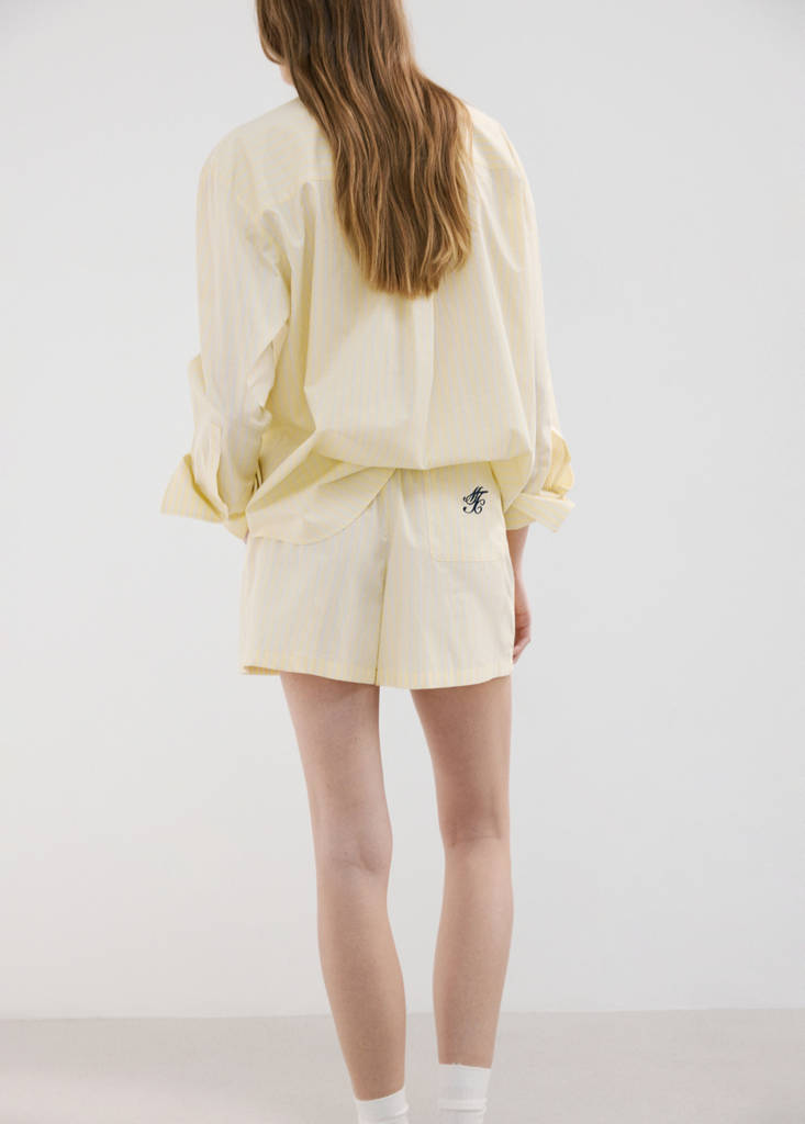 Striped poplin shorts with embroidered message — Yellow